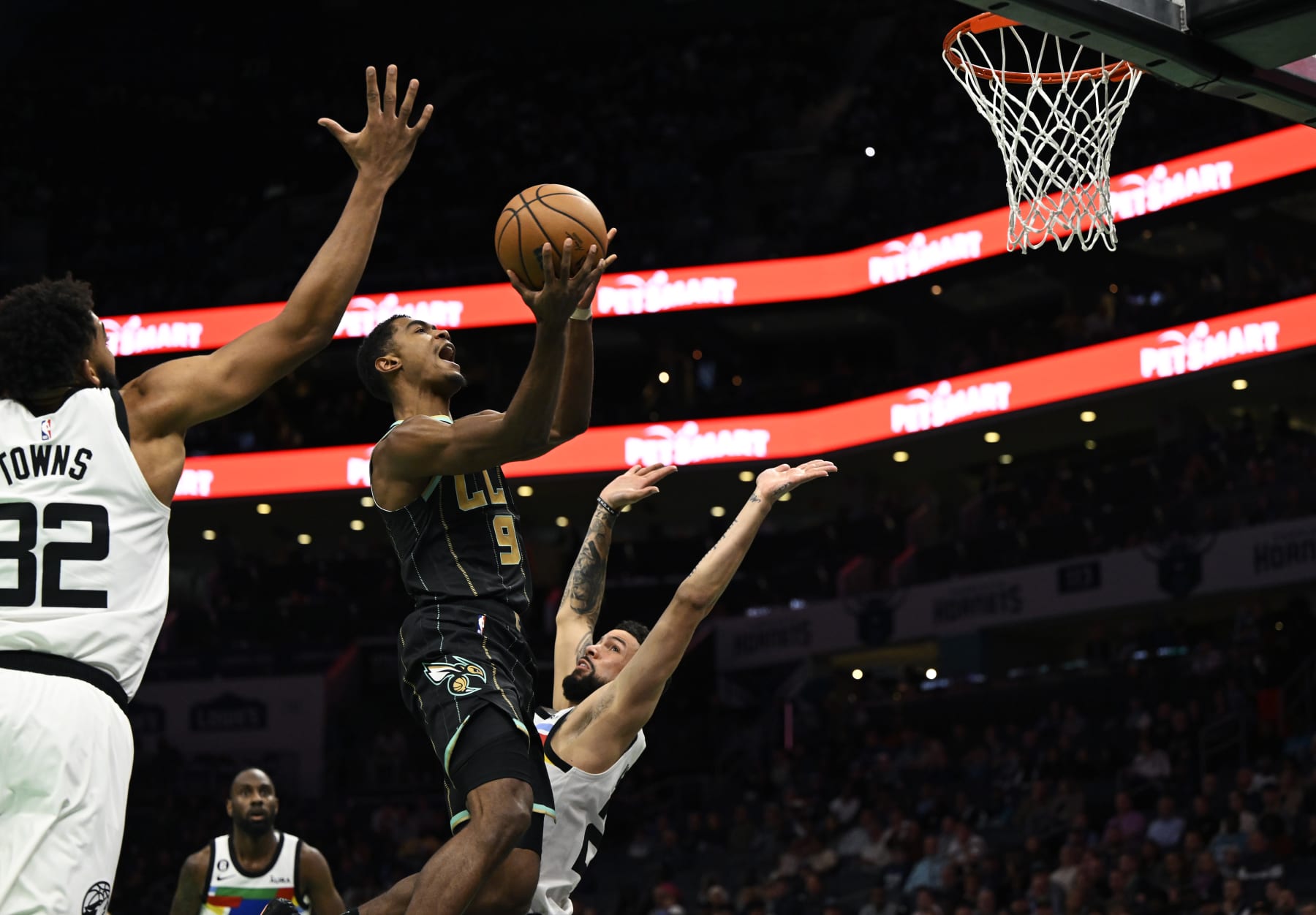 CHARLOTTE, NORTH CAROLINA - NOVEMBER 25: Theo Maledon #9 of the Charlotte Hornets gets fouled on the way to the basket against the Minnesota Timberwolves in the first quarter at Spectrum Center on November 25, 2022 in Charlotte, North Carolina. NOTE TO USER: User expressly acknowledges and agrees that, by downloading and or using this photograph, User is consenting to the terms and conditions of the Getty Images License Agreement. (Photo by Eakin Howard/Getty Images)