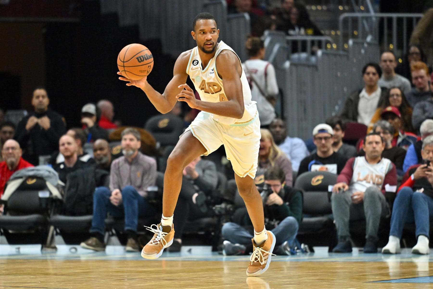 CLEVELAND, OHIO - NOVEMBER 30: Evan Mobley #4 of the Cleveland Cavaliers brings the ball up court during the second half against the Philadelphia 76ers at Rocket Mortgage Fieldhouse on November 30, 2022 in Cleveland, Ohio. The Cavaliers defeated the 76ers 113-85. NOTE TO USER: User expressly acknowledges and agrees that, by downloading and or using this photograph, User is consenting to the terms and conditions of the Getty Images License Agreement. (Photo by Jason Miller/Getty Images)