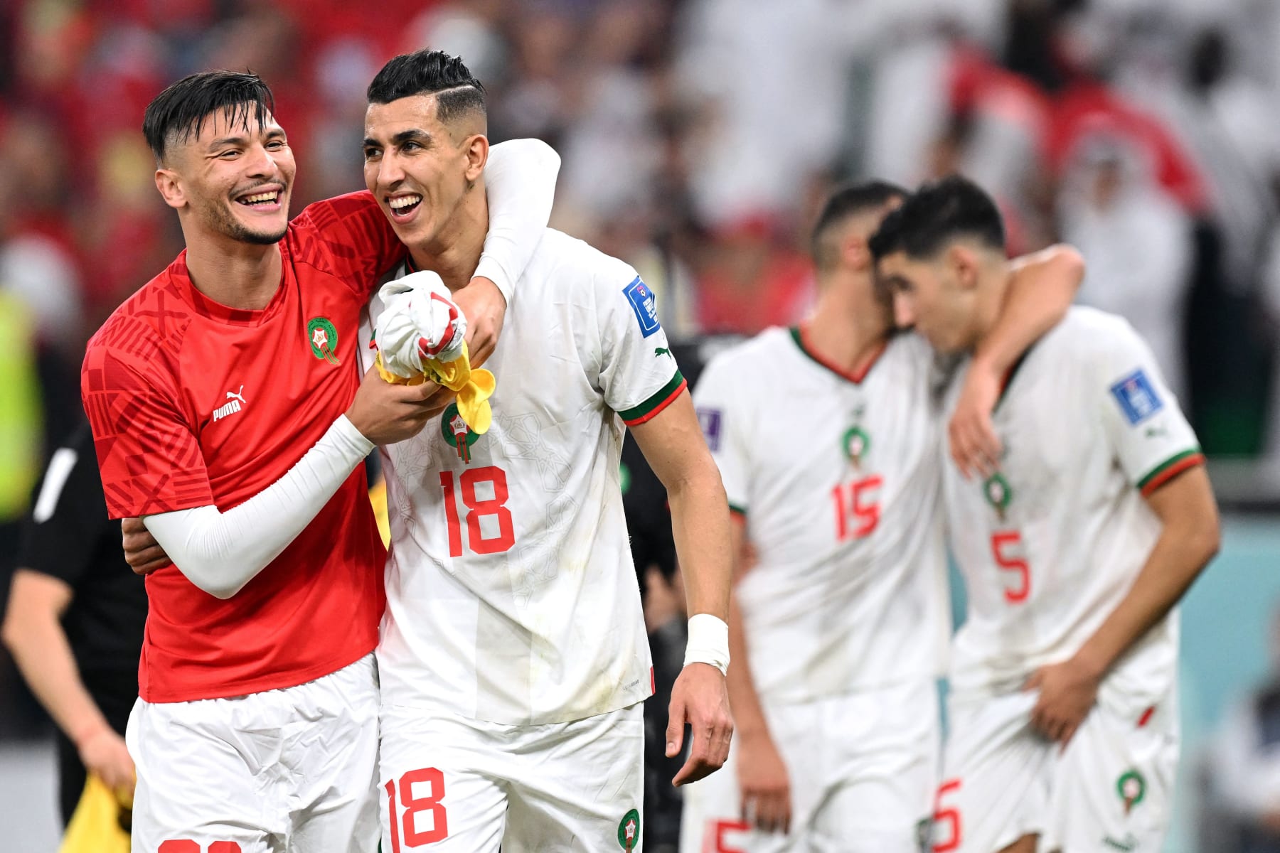 Morocco's defender #20 Achraf Dari (L) and Morocco's defender #18 Jawad El Yamiq celebrate winning the Qatar 2022 World Cup Group F football match between Canada and Morocco at the Al-Thumama Stadium in Doha on December 1, 2022, to advance to the round of 16. (Photo by NATALIA KOLESNIKOVA / AFP) (Photo by NATALIA KOLESNIKOVA/AFP via Getty Images)