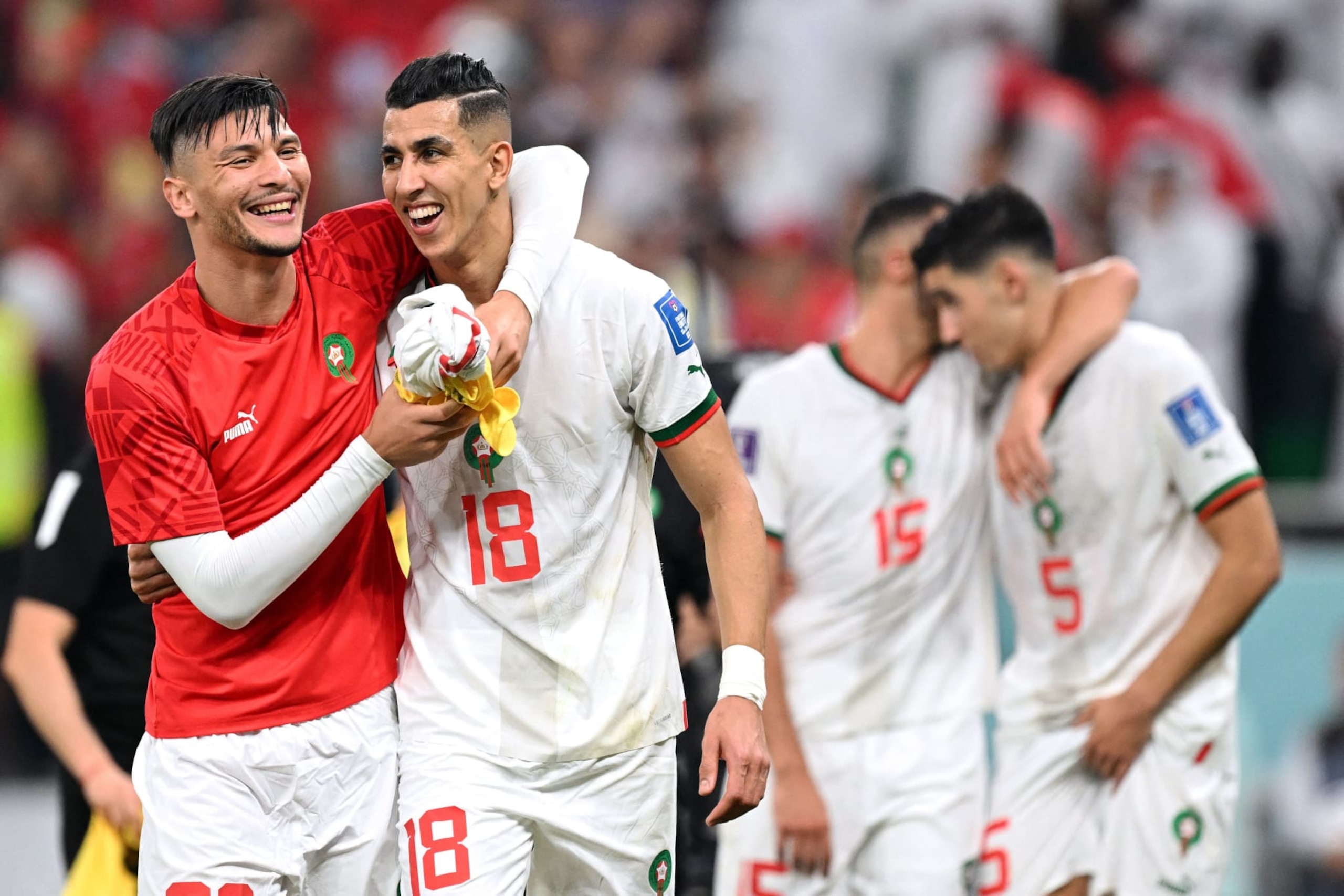 Morocco's defender #20 Achraf Dari (L) and Morocco's defender #18 Jawad El Yamiq celebrate winning the Qatar 2022 World Cup Group F football match between Canada and Morocco at the Al-Thumama Stadium in Doha on December 1, 2022, to advance to the round of 16. (Photo by NATALIA KOLESNIKOVA / AFP) (Photo by NATALIA KOLESNIKOVA/AFP via Getty Images)