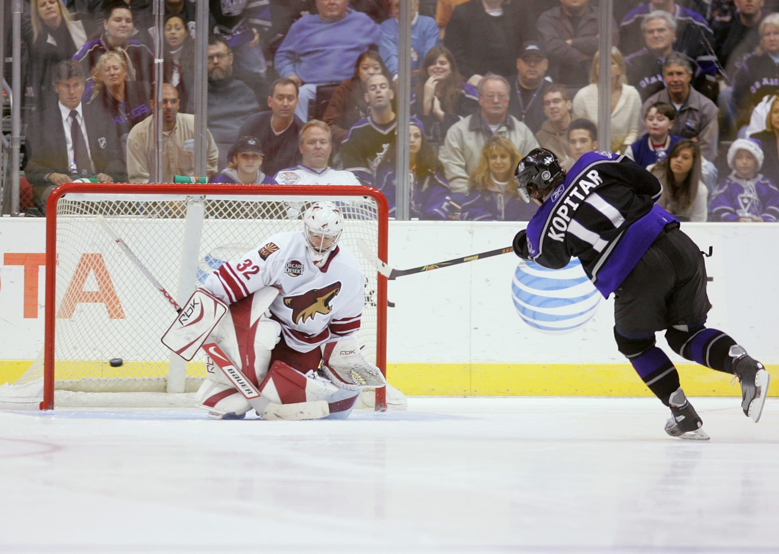 LOS ANGELES - DECEMBER 26: Anze Kopitar #11 of the Los Angeles Kings scores on Mikael Tellqvist #32 of the Phoenix Coyotes in the shootout during the game at Staples Center on December 26, 2006 in Los Angeles, California. The Kings won 4-3 in a shootout. (Photo by Jeff Gross/Getty Images) LOS ANGELES - DECEMBER 26: Anze Kopitar #11 of the Los Angeles Kings scores on Mikael Tellqvist #32 of the Phoenix Coyotes in the shootout during the game at Staples Center on December 26, 2006 in Los Angeles, California. The Kings won 4-3 in a shootout. (Photo by Jeff Gross/Getty Images)