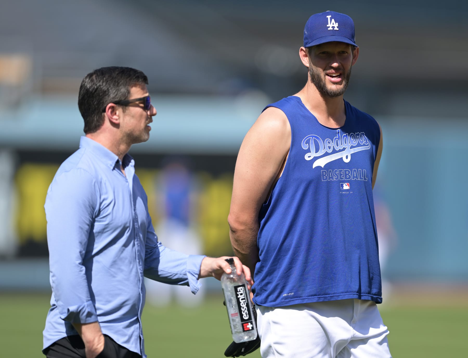 LOS ANGELES, CA - APRIL 05: Andrew Friedman, president of Baseball Operations for the Los Angeles Dodgers, talks with Clayton Kershaw #22 of before a preseason game against the Los Angeles Angels at Dodger Stadium on April 5, 2022 in Los Angeles, California. (Photo by Jayne Kamin-Oncea/Getty Images)