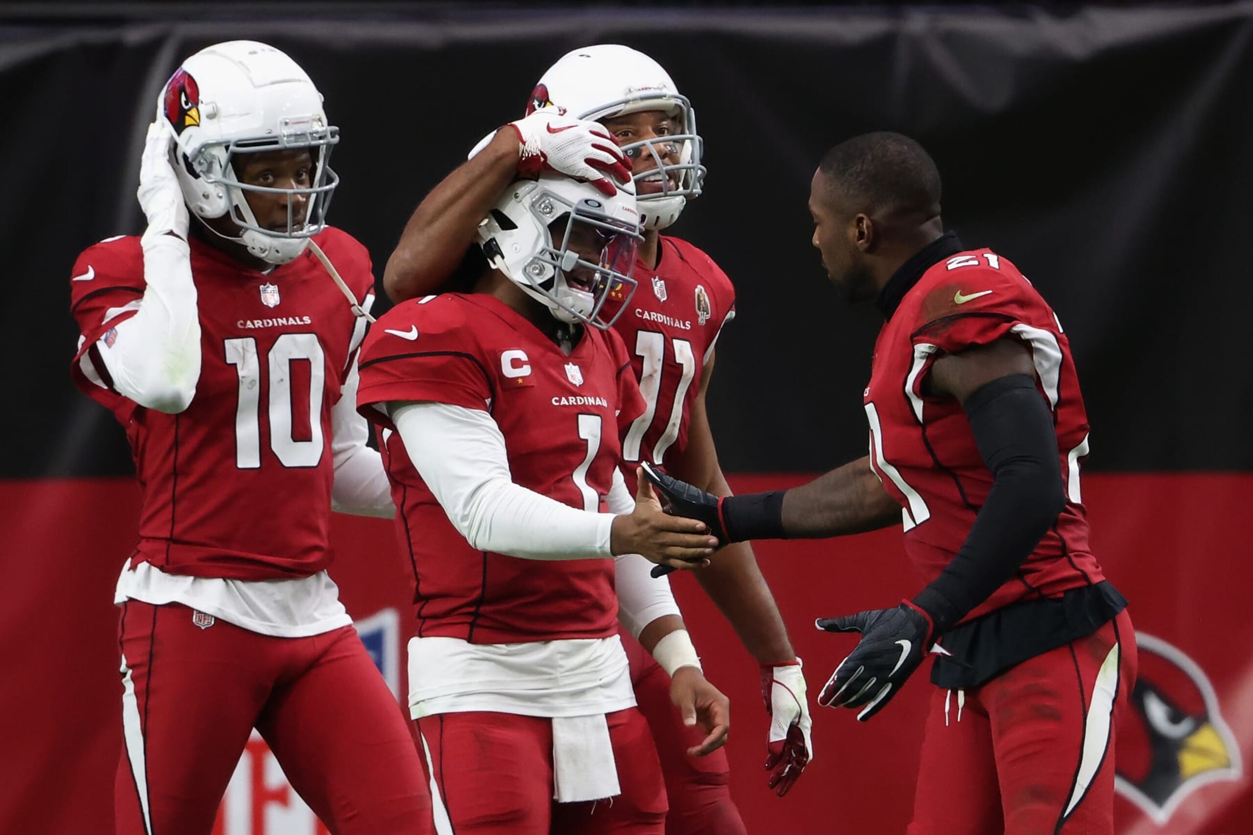 GLENDALE, ARIZONA - SEPTEMBER 20: Quarterback Kyler Murray #1 of the Arizona Cardinals is congratulated by DeAndre Hopkins #10, Larry Fitzgerald #11 and Patrick Peterson #21 after scoring a 21 yard rushing touchdown against the Washington Football Team during the second half of the NFL game at State Farm Stadium on September 20, 2020 in Glendale, Arizona. The Cardinals defeated the Washington Football Team 30-15.  (Photo by Christian Petersen/Getty Images)