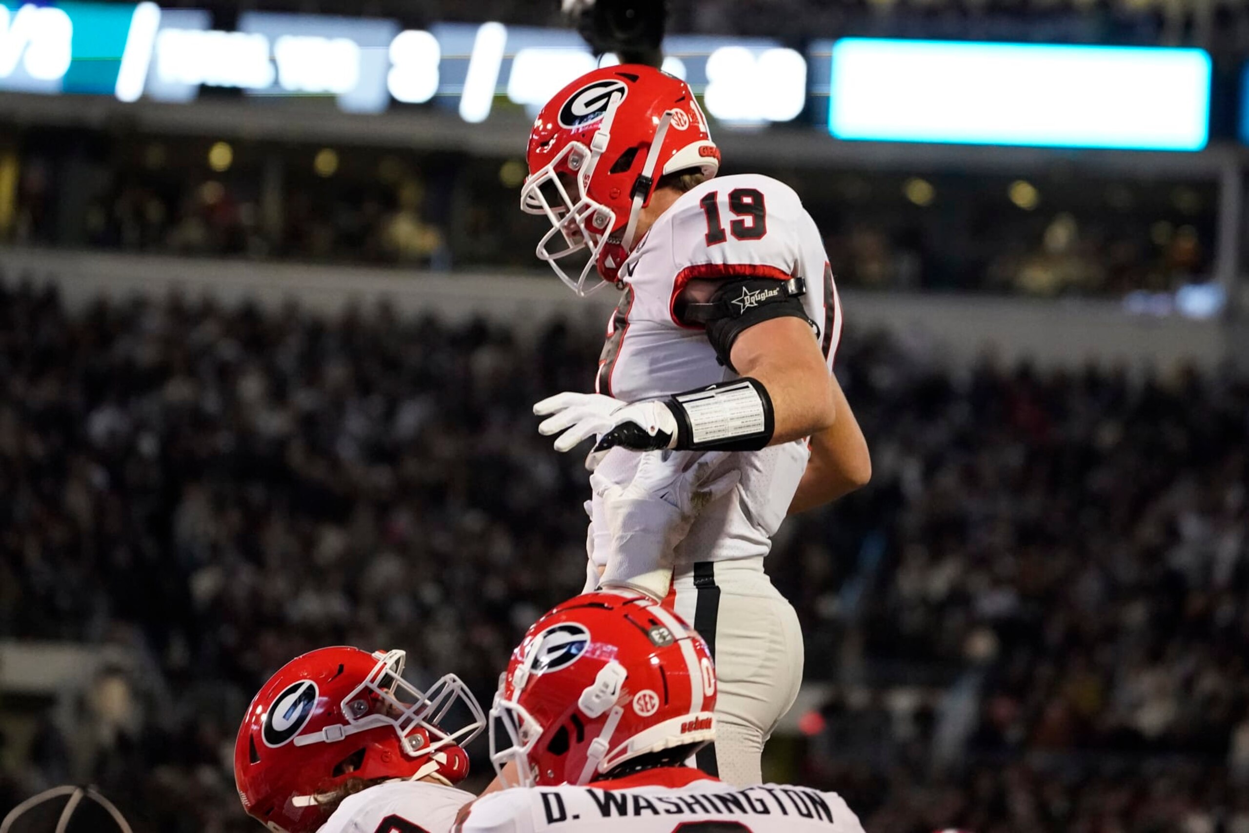Georgia tight end Brock Bowers (19) is lifted by a teammate after scoring on a two-yard touchdown pass reception during the first half of an NCAA college football game against Mississippi State in Starkville, Miss., Saturday, Nov. 12, 2022. (AP Photo/Rogelio V. Solis) Georgia tight end Brock Bowers (19) is lifted by a teammate after scoring on a two-yard touchdown pass reception during the first half of an NCAA college football game against Mississippi State in Starkville, Miss., Saturday, Nov. 12, 2022. (AP Photo/Rogelio V. Solis)