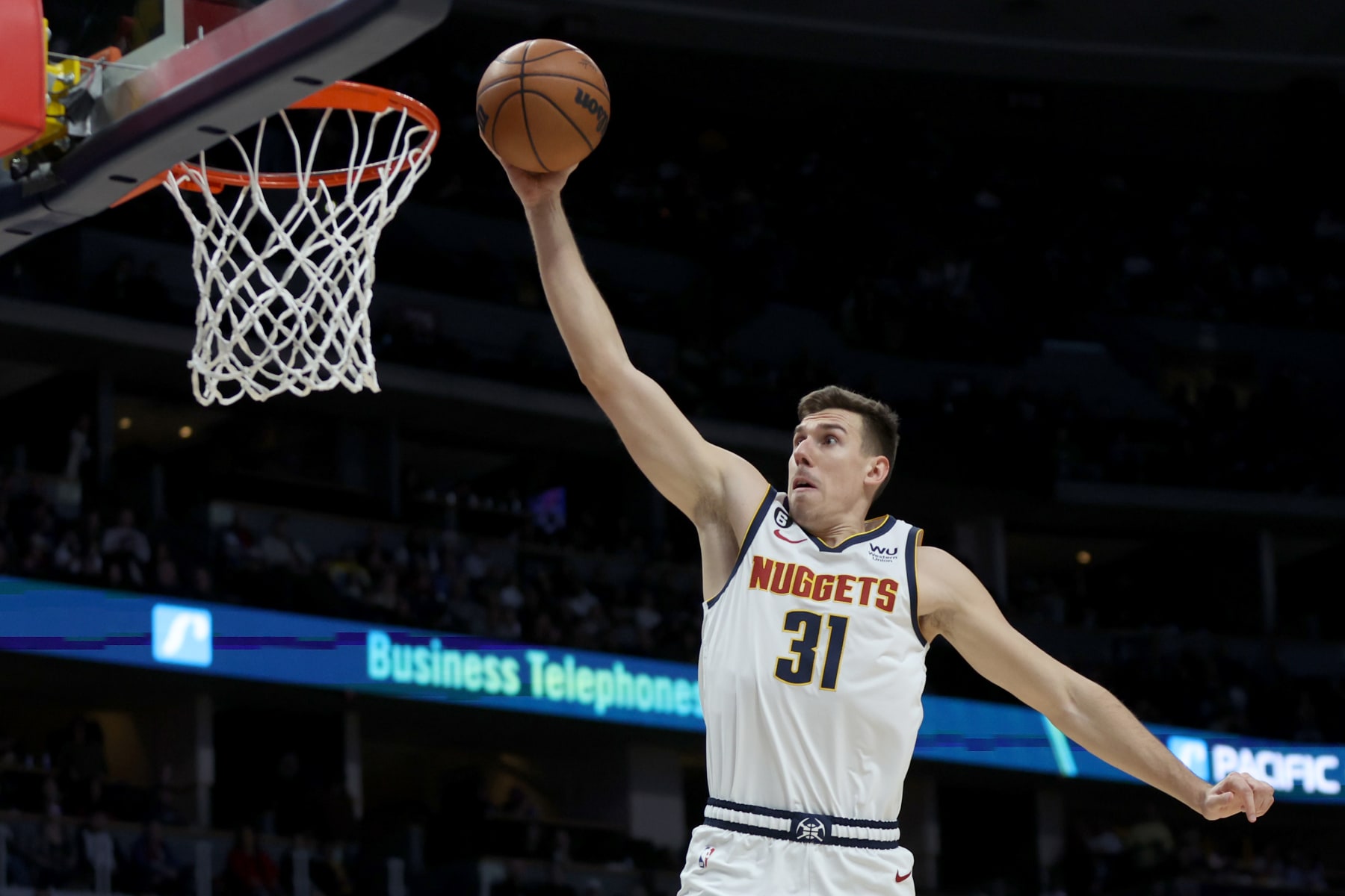DENVER, COLORADO - NOVEMBER 30: Vlatko Cancar #31 of the Denver Nuggets goes to the basket on a fast break against the Houston Rockets in the first quarter at Ball Arena on November 30, 2022 in Denver, Colorado. NOTE TO USER: User expressly acknowledges and agrees that, by downloading and/or using this photograph, User is consenting to the terms and conditions of the Getty Images License Agreement. (Photo by Matthew Stockman/Getty Images)