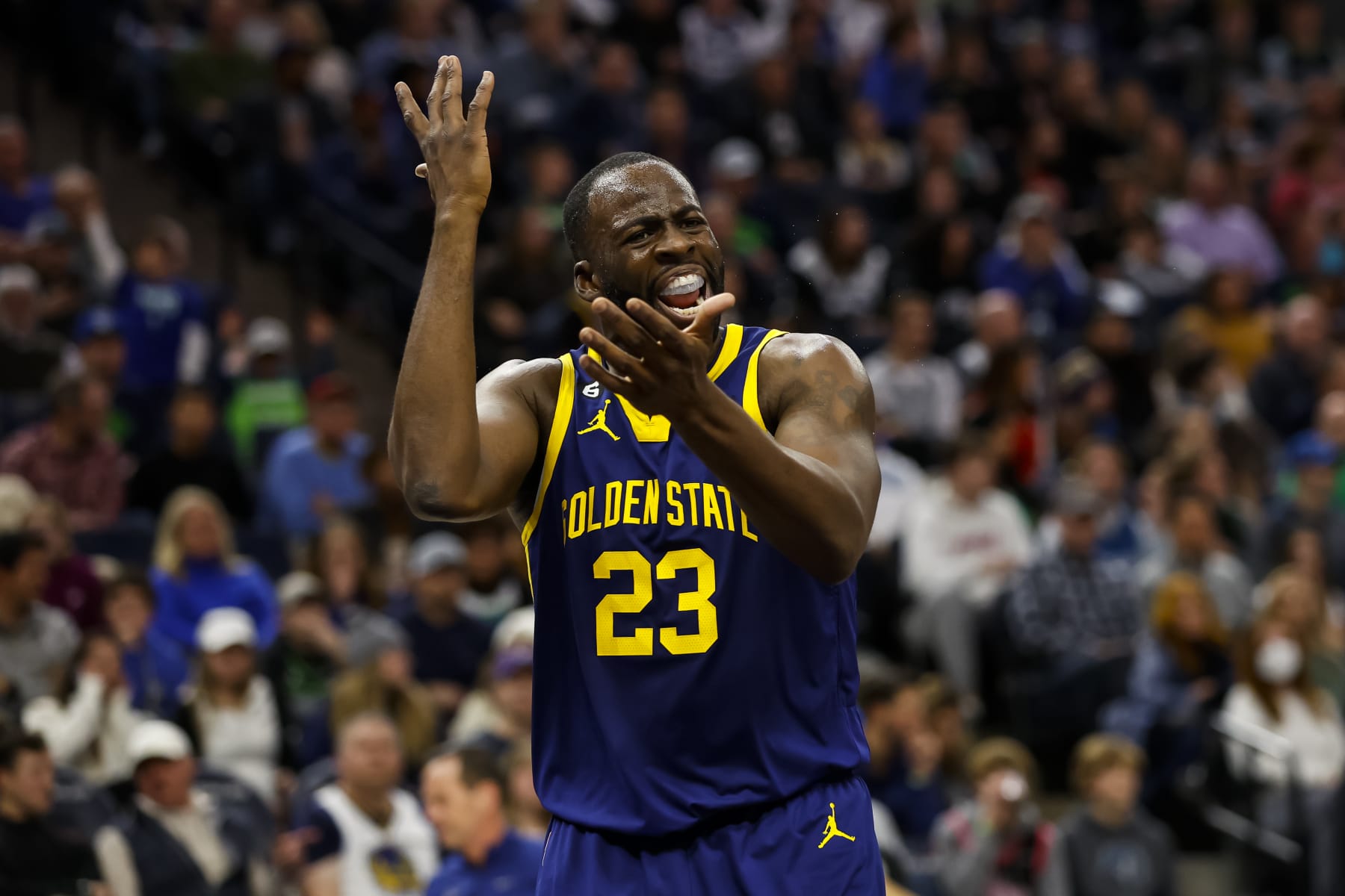 MINNEAPOLIS, MN - NOVEMBER 27: Draymond Green #23 of the Golden State Warriors reacts to a call on the floor in the fourth quarter against the Minnesota Timberwolves at Target Center on November 27, 2022 in Minneapolis, Minnesota. The Warriors defeated the Timberwolves 137-114. NOTE TO USER: User expressly acknowledges and agrees that, by downloading and or using this Photograph, user is consenting to the terms and conditions of the Getty Images License Agreement. (Photo by David Berding/Getty Images)