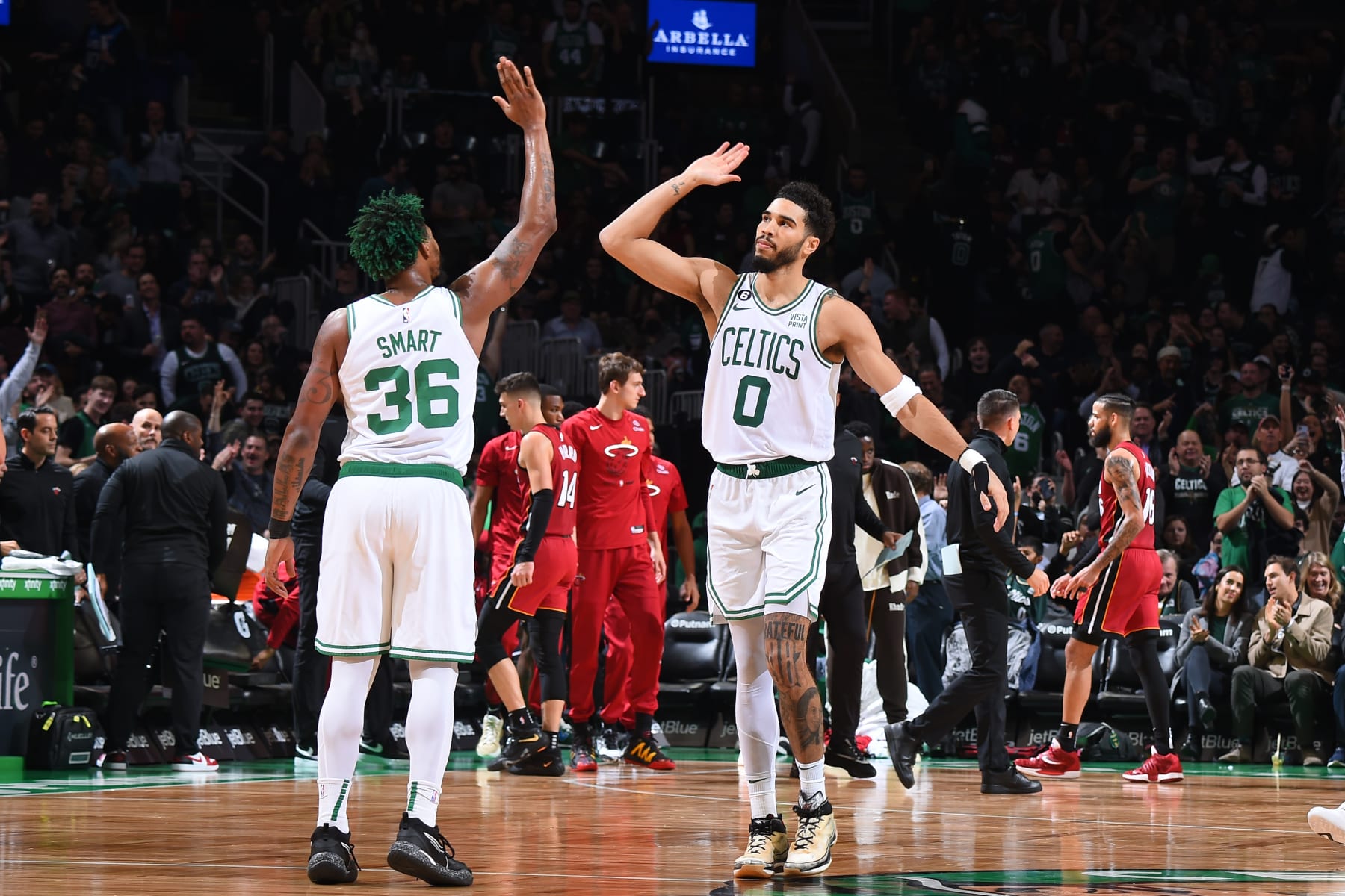 BOSTON, MA - NOVEMBER 30: Marcus Smart #36 of the Boston Celtics high fives Jayson Tatum #0 during the game against the Miami Heat on November 30, 2022 at the TD Garden in Boston, Massachusetts.  NOTE TO USER: User expressly acknowledges and agrees that, by downloading and or using this photograph, User is consenting to the terms and conditions of the Getty Images License Agreement. Mandatory Copyright Notice: Copyright 2022 NBAE  (Photo by Brian Babineau/NBAE via Getty Images)