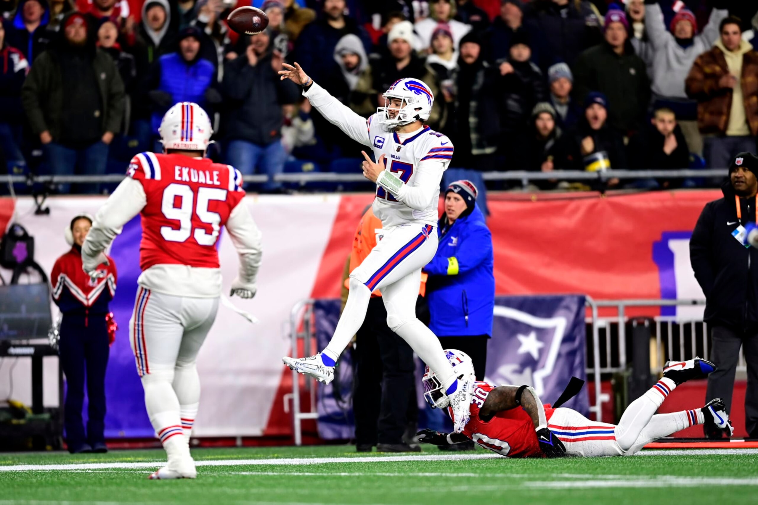 FOXBOROUGH, MASSACHUSETTS - DECEMBER 01: Quarterback Josh Allen #17 of the Buffalo Bills throws a second quarter touchdown pass in front of linebacker Mack Wilson Sr. #30 of the New England Patriots at Gillette Stadium on December 01, 2022 in Foxborough, Massachusetts. (Photo by Billie Weiss/Getty Images)