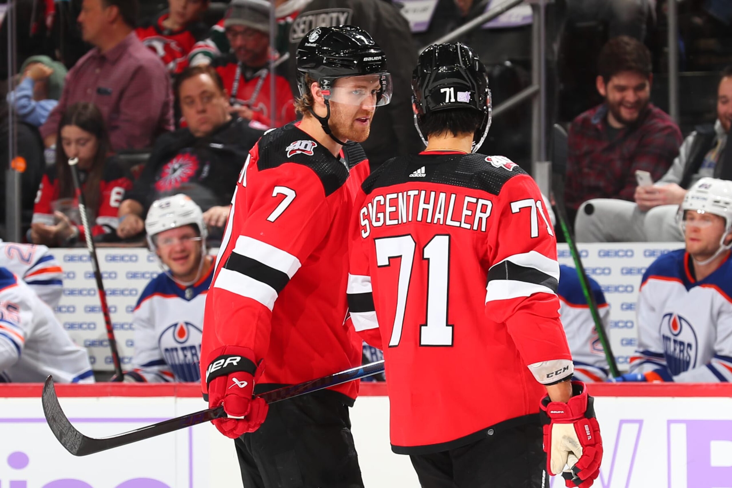 NEWARK, NJ - NOVEMBER 21:  Dougie Hamilton #7 of the New Jersey Devils and Jonas Siegenthaler #71 of the New Jersey Devils during the game against the Edmonton Oilers on November 21, 2022 at the Prudential Center in Newark, New Jersey.  (Photo by Rich Graessle/NHLI via Getty Images)