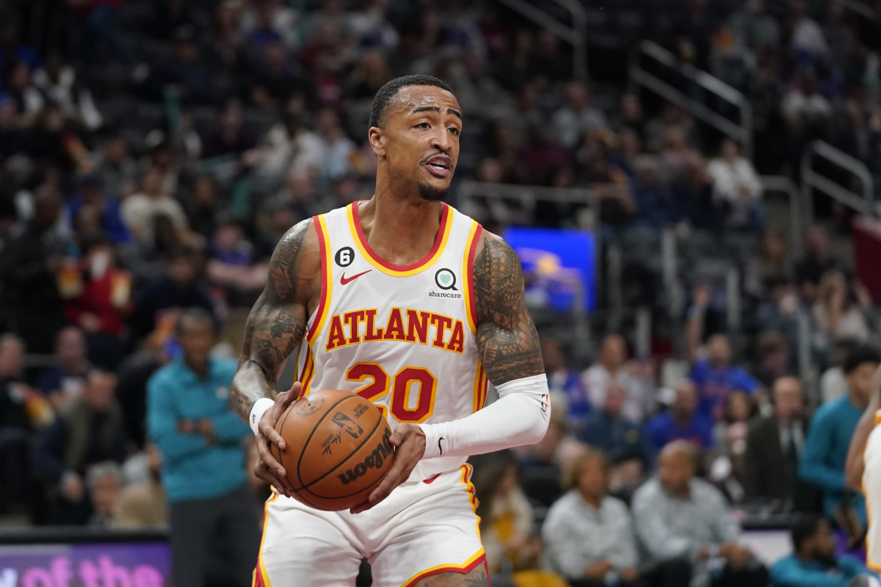 Atlanta Hawks forward John Collins (20) pulls down a rebound against the Detroit Pistons in the first half of an NBA basketball game in Detroit, Friday, Oct. 28, 2022. (AP Photo/Paul Sancya)