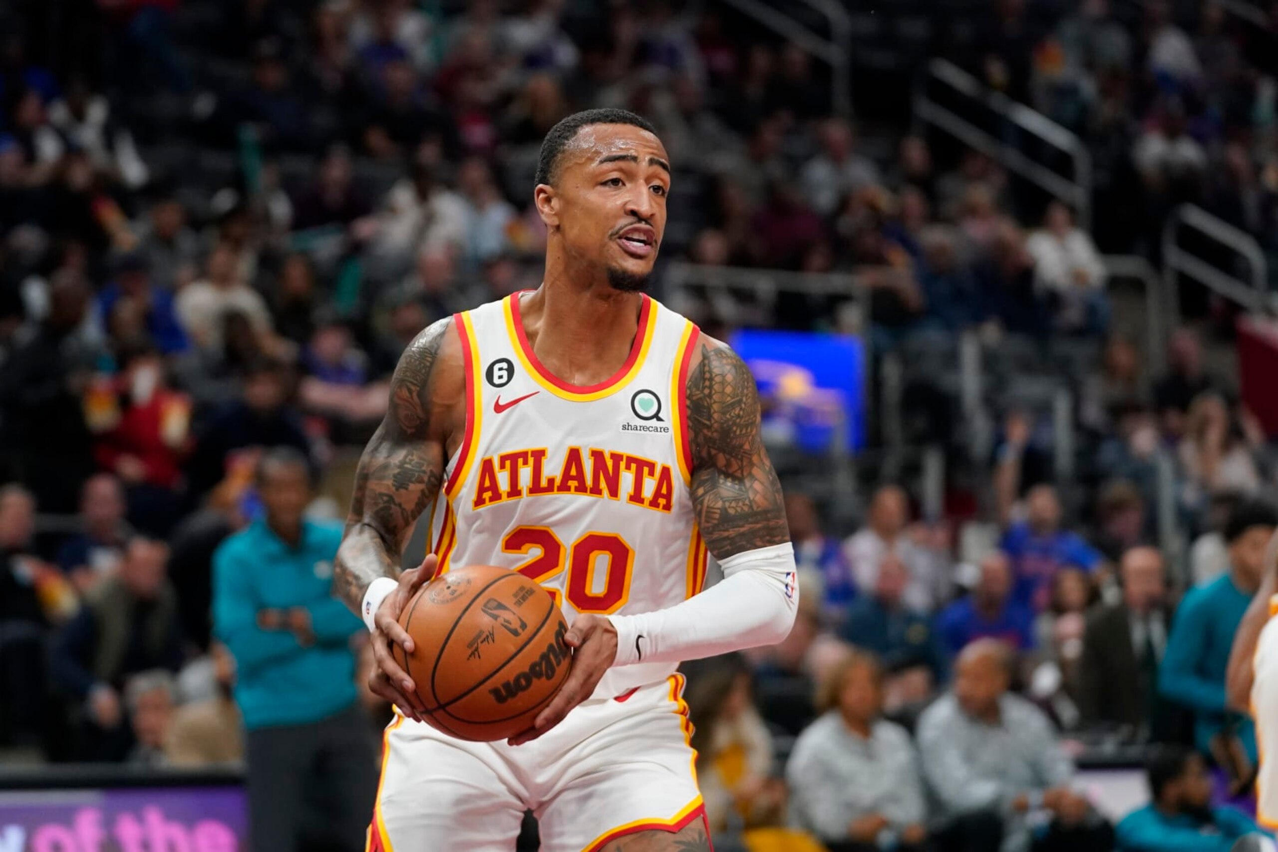 Atlanta Hawks forward John Collins (20) pulls down a rebound against the Detroit Pistons in the first half of an NBA basketball game in Detroit, Friday, Oct. 28, 2022. (AP Photo/Paul Sancya)