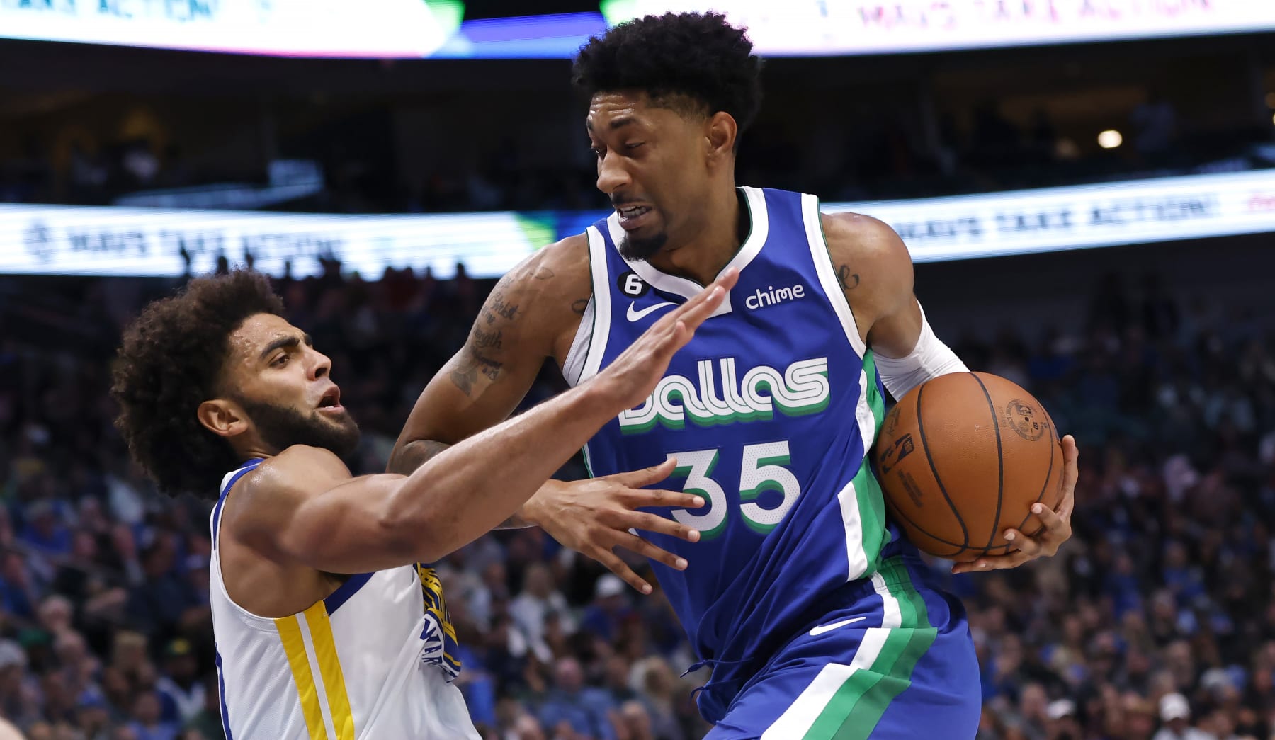 DALLAS, TX - NOVEMBER 29: Christian Wood #35 of the Dallas Mavericks is fouled by Anthony Lamb #40 of the Golden State Warriors in the first half at American Airlines Center on November 29, 2022 in Dallas, Texas. NOTE TO USER: User expressly acknowledges and agrees that, by downloading and or using this photograph, User is consenting to the terms and conditions of the Getty Images License Agreement. (Photo by Ron Jenkins/Getty Images)