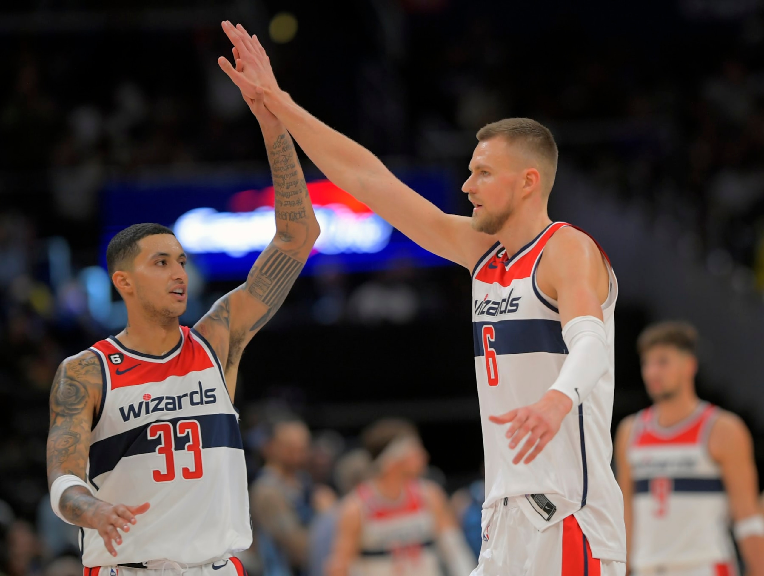 WASHINGTON, DC - NOVEMBER 13: Washington Wizards forward Kyle Kuzma (33),, left, congratulates Washington Wizards center Kristaps Porzingis (6) after hitting a 3 pointer during the Washington Wizards defeat of the Memphis Grizzlies102-92 at the Capital One Arena on November 13, 2022 in Washington, DC. (Photo by John McDonnell/The Washington Post via Getty Images) WASHINGTON, DC - NOVEMBER 13: Washington Wizards forward Kyle Kuzma (33),, left, congratulates Washington Wizards center Kristaps Porzingis (6) after hitting a 3 pointer during the Washington Wizards defeat of the Memphis Grizzlies102-92 at the Capital One Arena on November 13, 2022 in Washington, DC. (Photo by John McDonnell/The Washington Post via Getty Images)