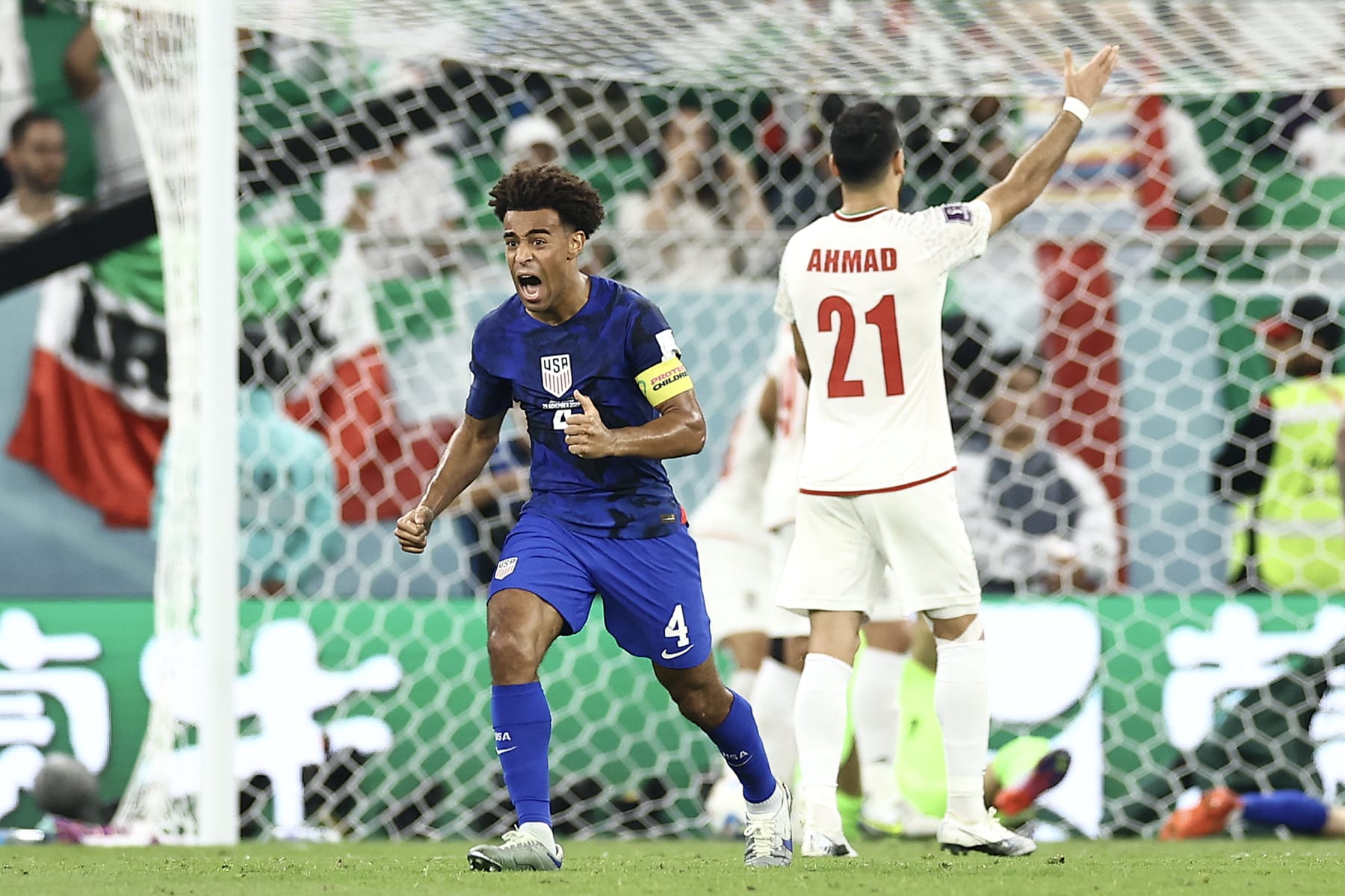 DOHA, QATAR - NOVEMBER 29: Tyler Adams of United States reacts following the team's first goal during the FIFA World Cup Qatar 2022 Group B match between IR Iran and USA at Al Thumama Stadium on November 29, 2022 in Doha, Qatar. (Photo by Tim Nwachukwu/Getty Images)