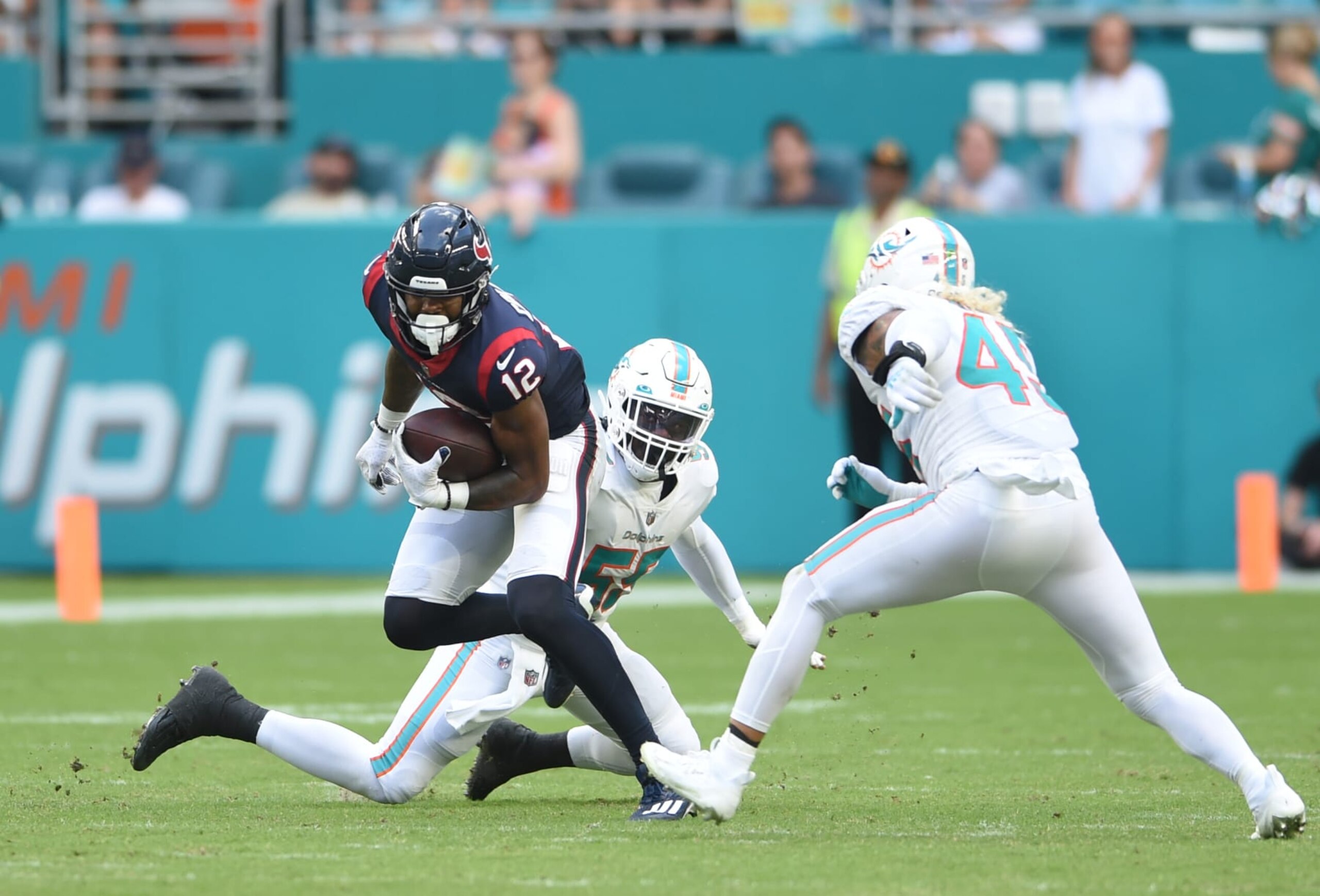 MIAMI GARDENS, FL - NOVEMBER 27: Houston Texans WR Nico Collins (12) runs for yardage in game featuring the Houston Texans and the Miami Dolphins on November 27, 2022 at Hard Rock Stadium in Miami Gardens, FL. (Photo by John Rivera/Icon Sportswire via Getty Images)