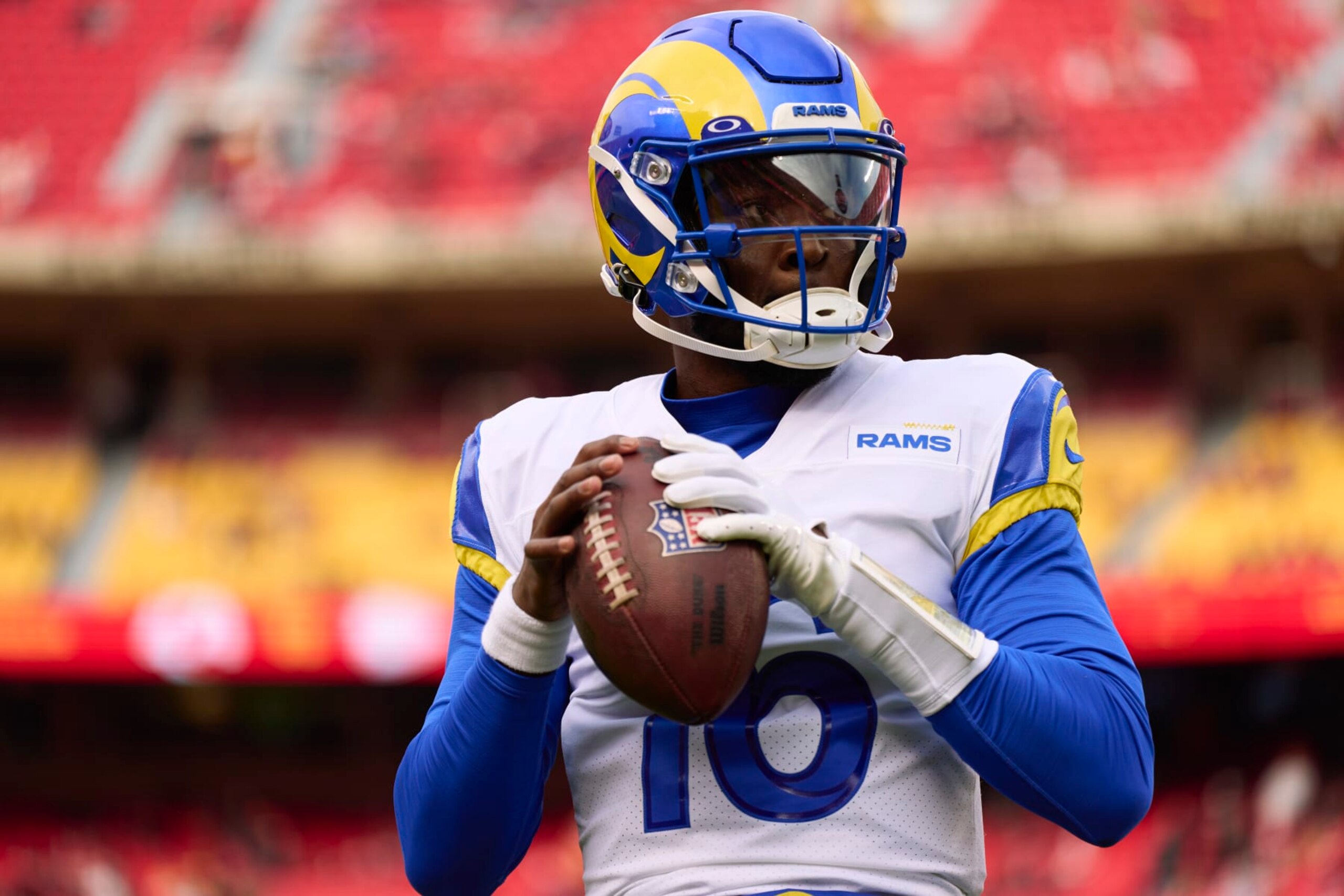 KANSAS CITY, MO - NOVEMBER 27: Bryce Perkins #16 of the Los Angeles Rams warms up before kickoff against the Kansas City Chiefs at GEHA Field at Arrowhead Stadium on November 27, 2022 in Kansas City, Missouri. (Photo by Cooper Neill/Getty Images)
