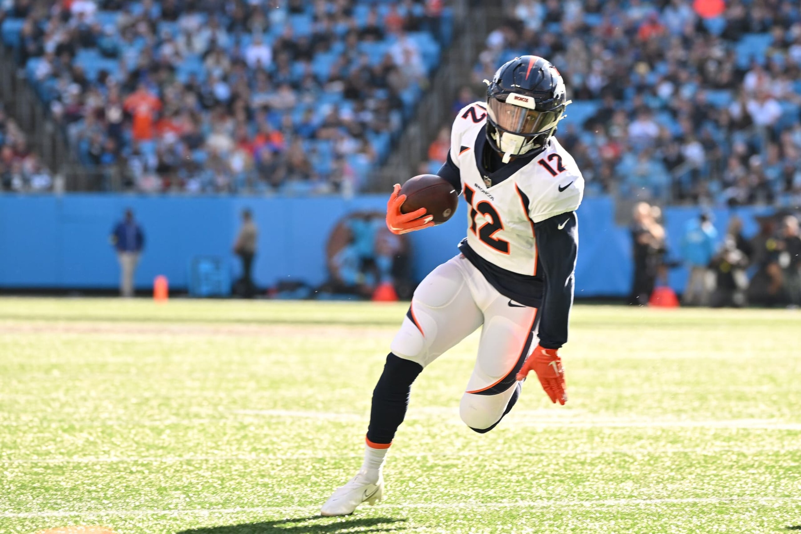 CHARLOTTE, NORTH CAROLINA - NOVEMBER 27: Montrell Washington #12 of the Denver Broncos runs the ball against the Carolina Panthers during their game at Bank of America Stadium on November 27, 2022 in Charlotte, North Carolina. (Photo by Grant Halverson/Getty Images)