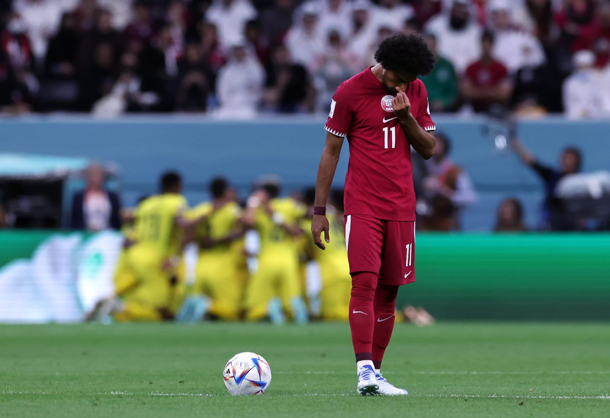 AL KHOR, QATAR - NOVEMBER 20: Akram Afif of Qatar is dejected after Enner Valencia of Ecuador scores a penalty during the FIFA World Cup Qatar 2022 Group A match between Qatar and Ecuador at Al Bayt Stadium on November 20, 2022 in Al Khor, Qatar. (Photo by Ian MacNicol/Getty Images)
