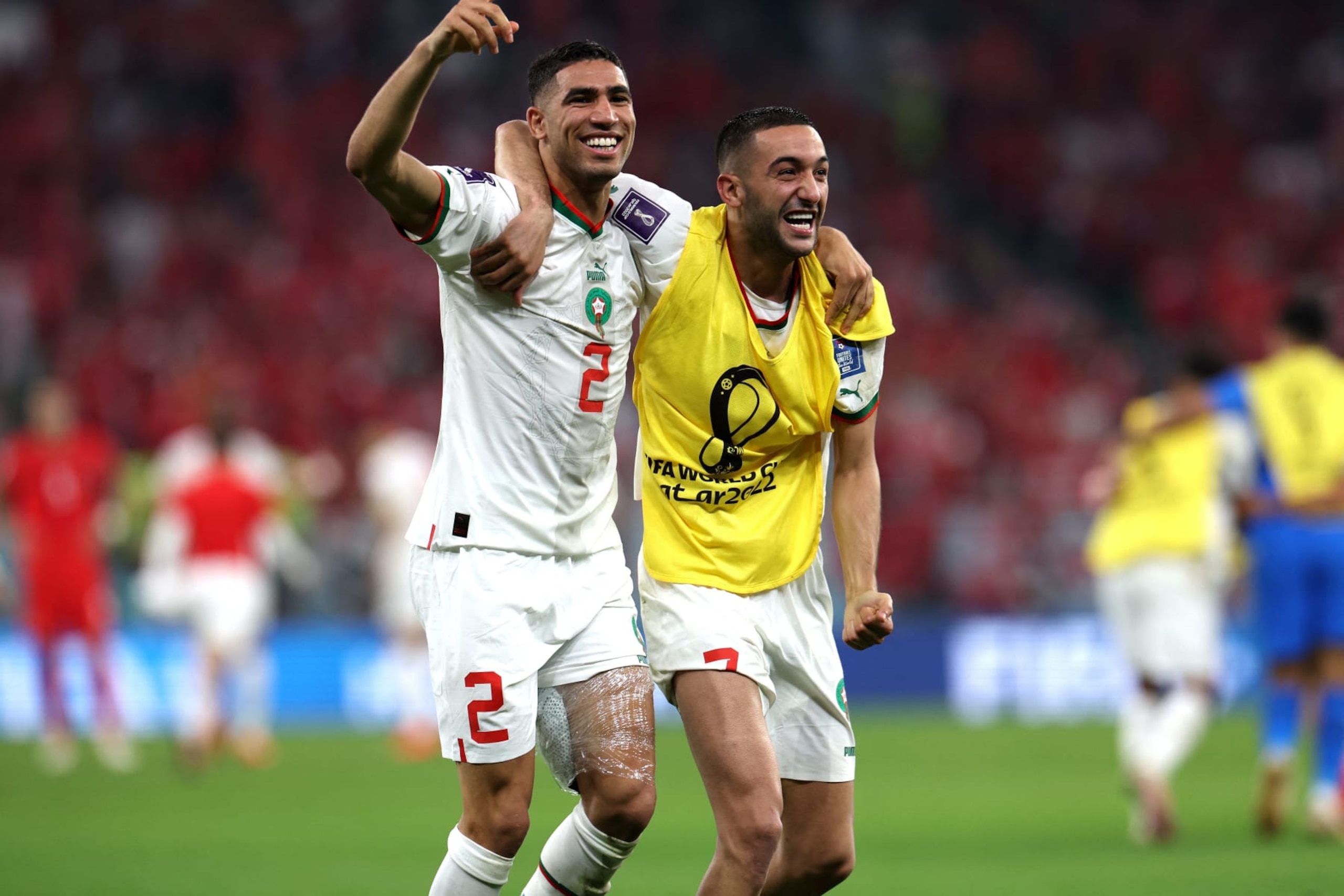 Morocco's defender #02 Achraf Hakimi and midfielder #07 Hakim Ziyech celebrate winning the Qatar 2022 World Cup Group F football match between Canada and Morocco at the Al-Thumama Stadium in Doha on December 1, 2022. (Photo by Fadel Senna / AFP) (Photo by FADEL SENNA/AFP via Getty Images)
