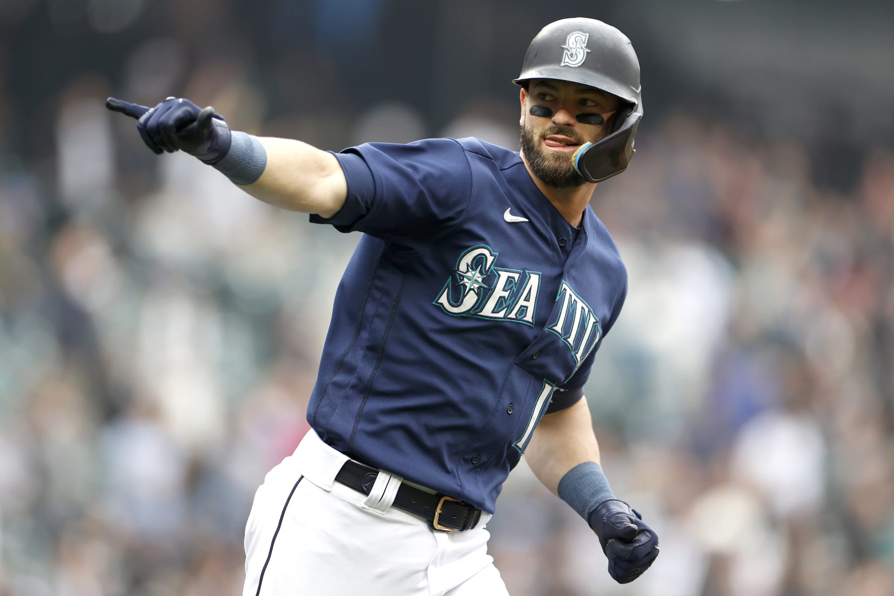 SEATTLE, WASHINGTON - OCTOBER 05: Mitch Haniger #17 of the Seattle Mariners celebrates his home run against the Detroit Tigers during the first inning at T-Mobile Park on October 05, 2022 in Seattle, Washington. (Photo by Steph Chambers/Getty Images)