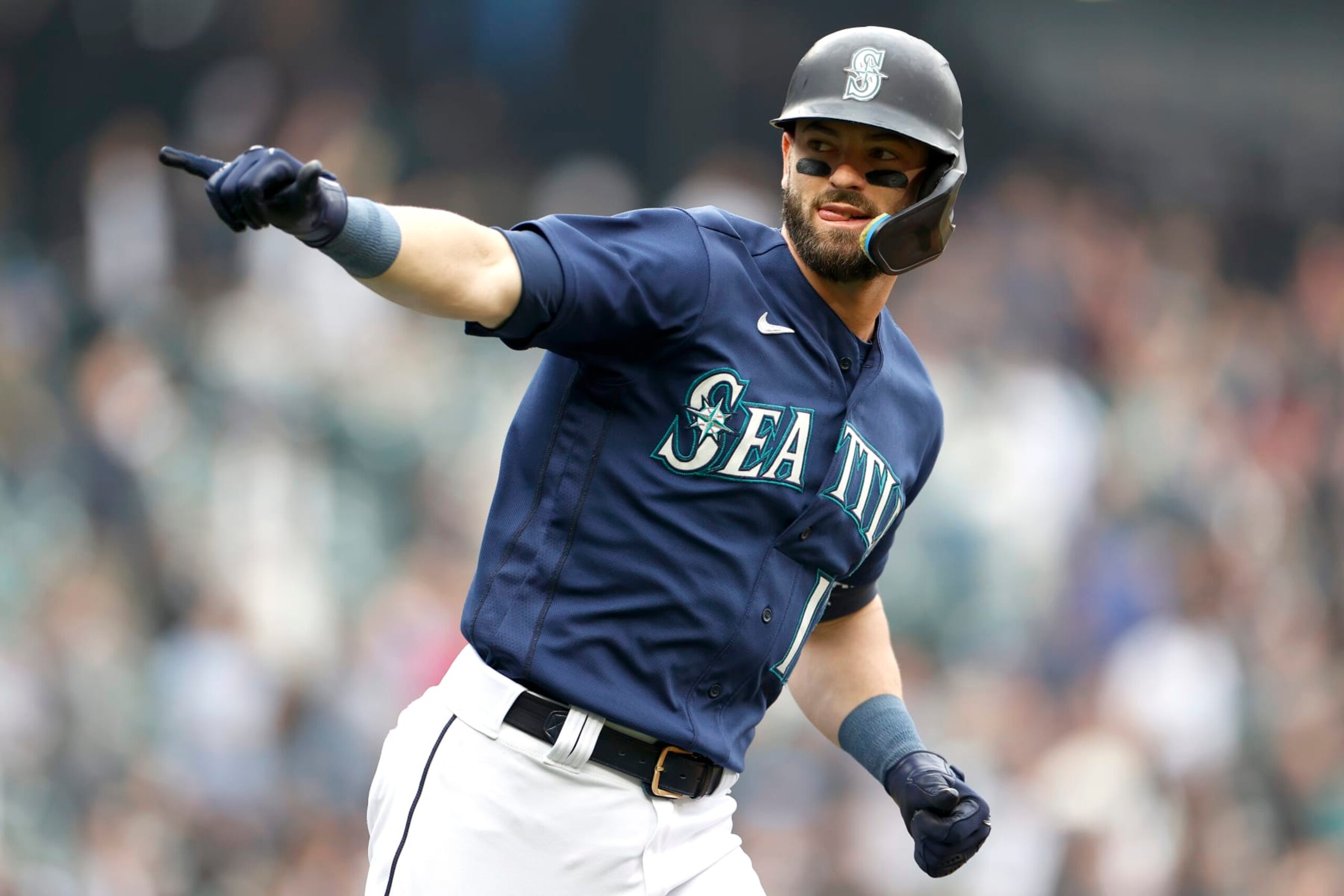 SEATTLE, WASHINGTON - OCTOBER 05: Mitch Haniger #17 of the Seattle Mariners celebrates his home run against the Detroit Tigers during the first inning at T-Mobile Park on October 05, 2022 in Seattle, Washington. (Photo by Steph Chambers/Getty Images)