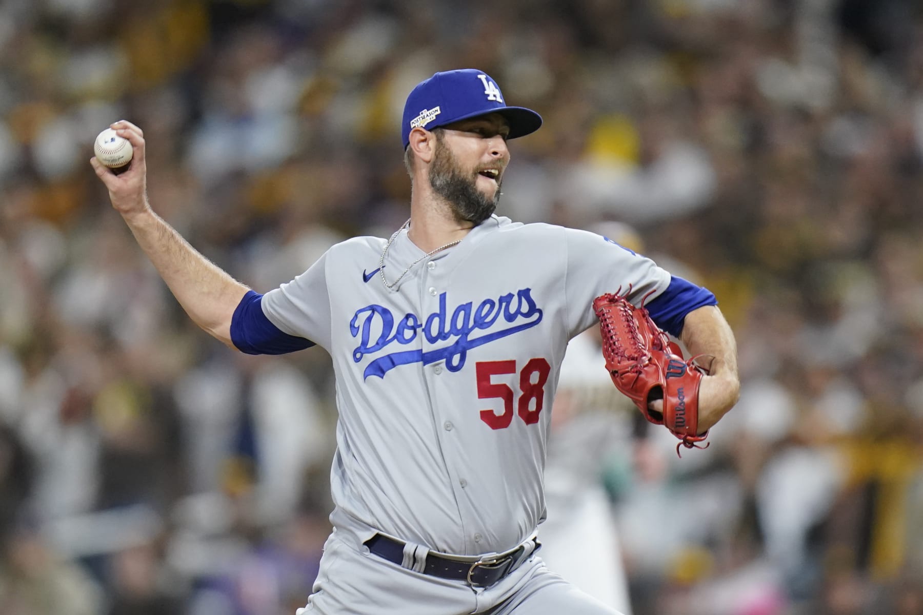 Los Angeles Dodgers relief pitcher Chris Martin works against a San Diego Padres batter during the sixth inning in Game 4 of a baseball NL Division Series, Saturday, Oct. 15, 2022, in San Diego. (AP Photo/Jae C. Hong)
