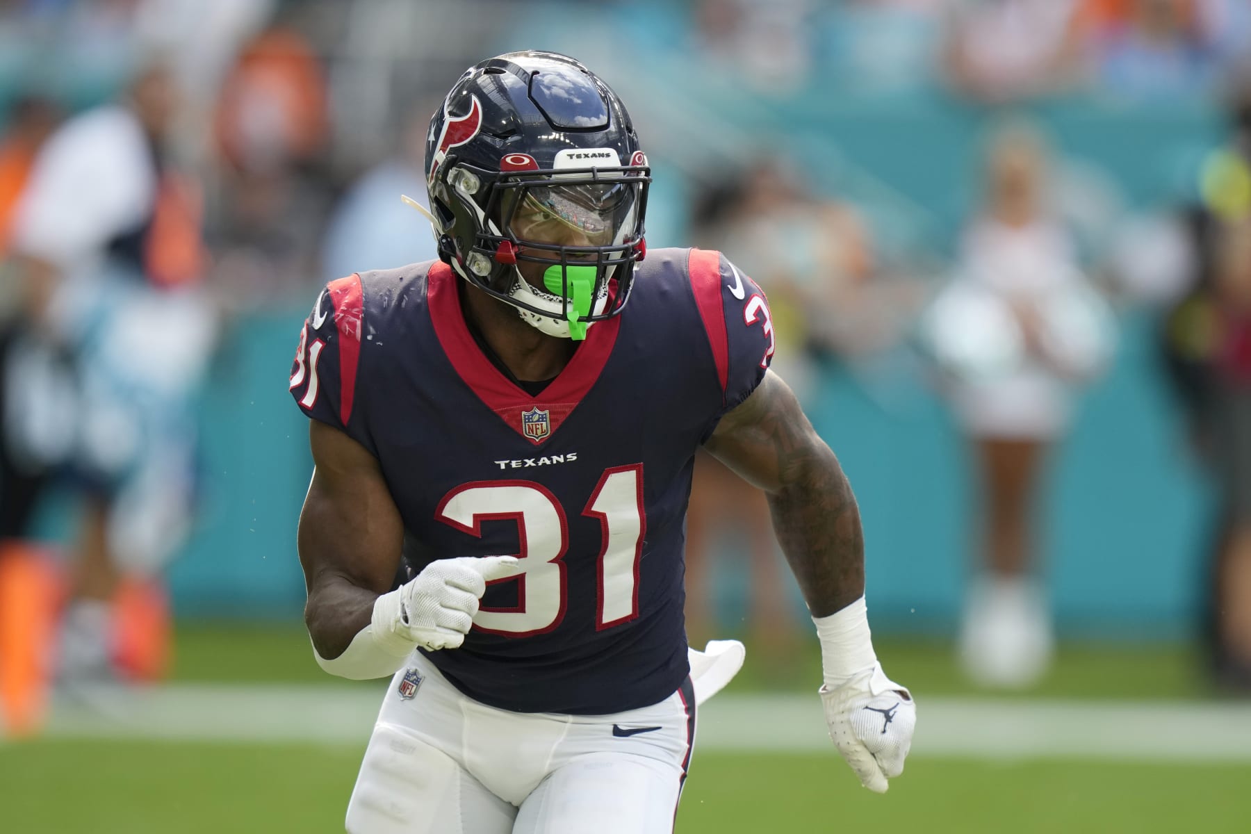 Houston Texans running back Dameon Pierce (31) runs a play during the first half of an NFL football game against the Miami Dolphins, Sunday, Nov. 27, 2022, in Miami Gardens, Fla. (AP Photo/Lynne Sladky)