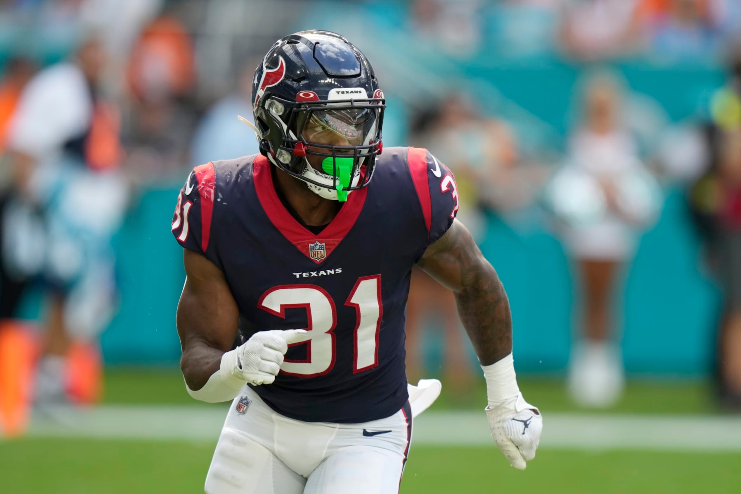 Houston Texans running back Dameon Pierce (31) runs a play during the first half of an NFL football game against the Miami Dolphins, Sunday, Nov. 27, 2022, in Miami Gardens, Fla. (AP Photo/Lynne Sladky)