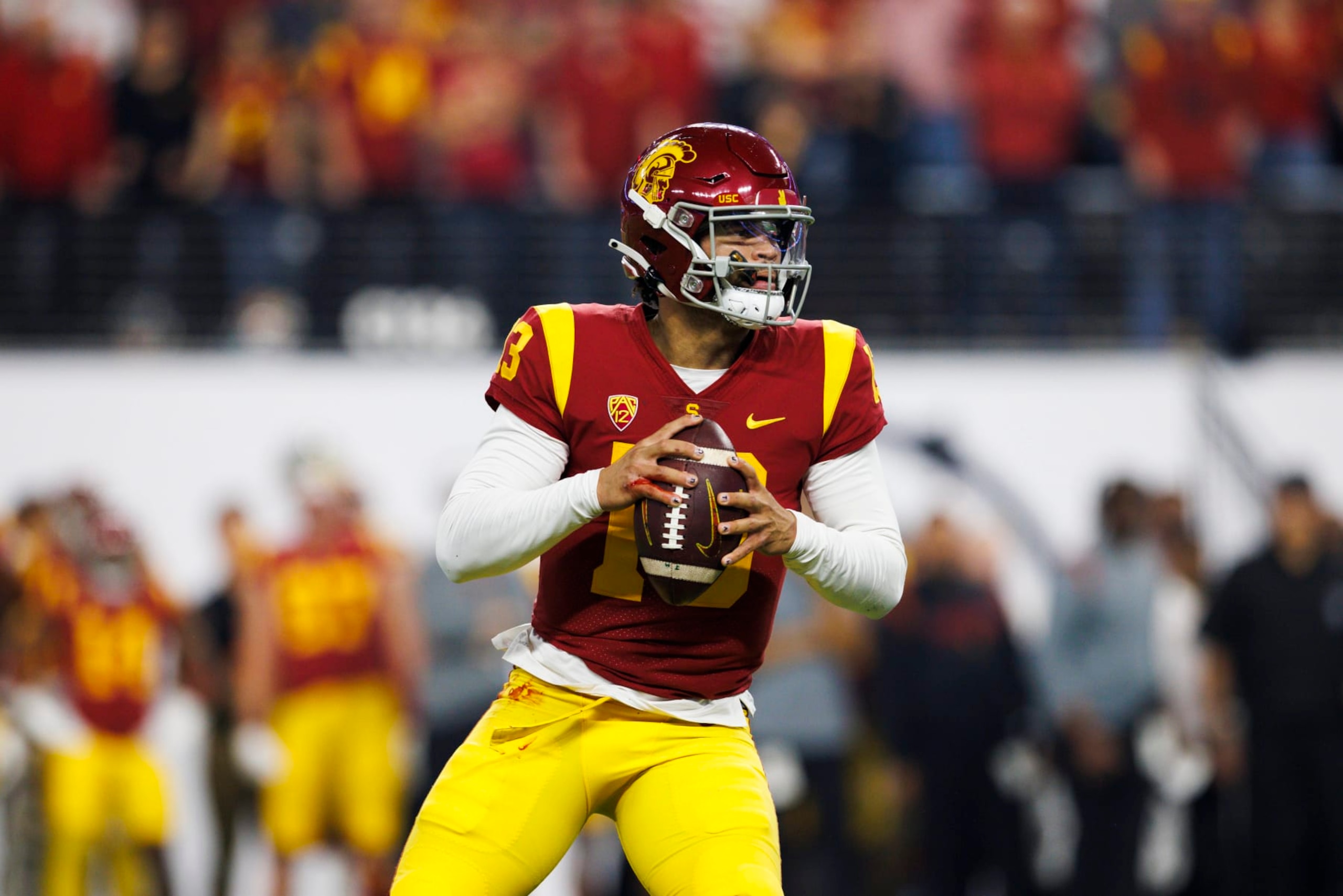 LAS VEGAS, NV - DECEMBER 02: USC Trojans quarterback Caleb Williams (13) drops back to pass during the Pac-12 Championship football game between Utah Utes and USC Trojans on December 2, 2022 at Allegiant Stadium in Las Vegas, NV. (Photo by Ric Tapia/Icon Sportswire via Getty Images)