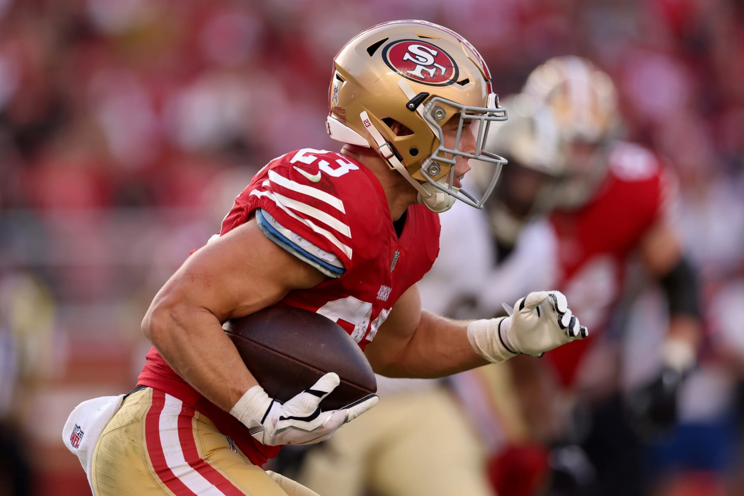 SANTA CLARA, CALIFORNIA - NOVEMBER 27: Christian McCaffrey #23 of the San Francisco 49ers runs the ball during the first half in the game against the New Orleans Saints at Levi's Stadium on November 27, 2022 in Santa Clara, California. (Photo by Ezra Shaw/Getty Images) SANTA CLARA, CALIFORNIA - NOVEMBER 27: Christian McCaffrey #23 of the San Francisco 49ers runs the ball during the first half in the game against the New Orleans Saints at Levi's Stadium on November 27, 2022 in Santa Clara, California. (Photo by Ezra Shaw/Getty Images)