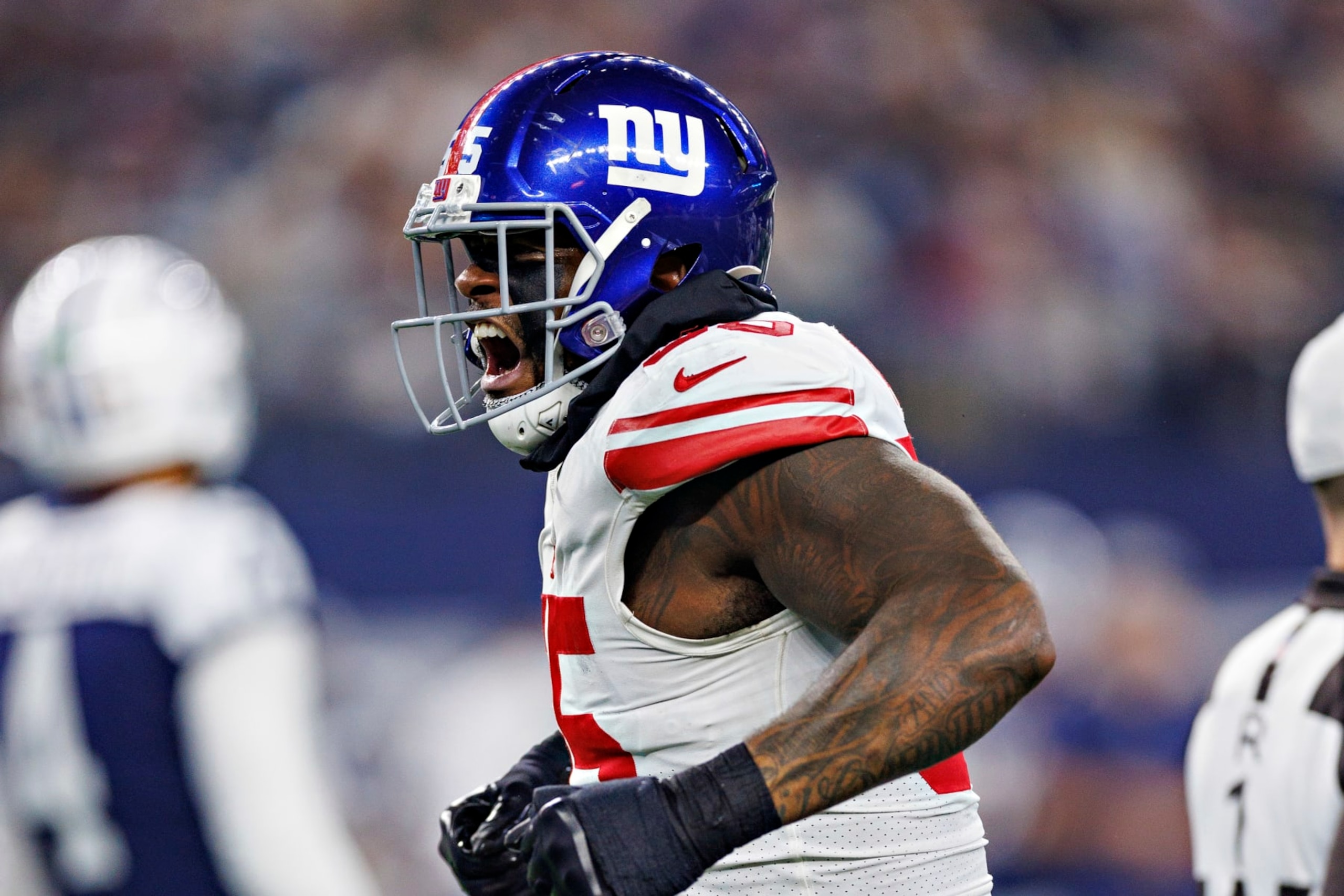 ARLINGTON, TEXAS - NOVEMBER 24: Jihad Ward #55 of the New York Giants celebrates after making a big tackle during a game against the Dallas Cowboys at AT&T Stadium on November 24, 2022 in Arlington, Texas. The Cowboys defeated the Giants 28-20. (Photo by Wesley Hitt/Getty Images) ARLINGTON, TEXAS - NOVEMBER 24: Jihad Ward #55 of the New York Giants celebrates after making a big tackle during a game against the Dallas Cowboys at AT&T Stadium on November 24, 2022 in Arlington, Texas. The Cowboys defeated the Giants 28-20. (Photo by Wesley Hitt/Getty Images)