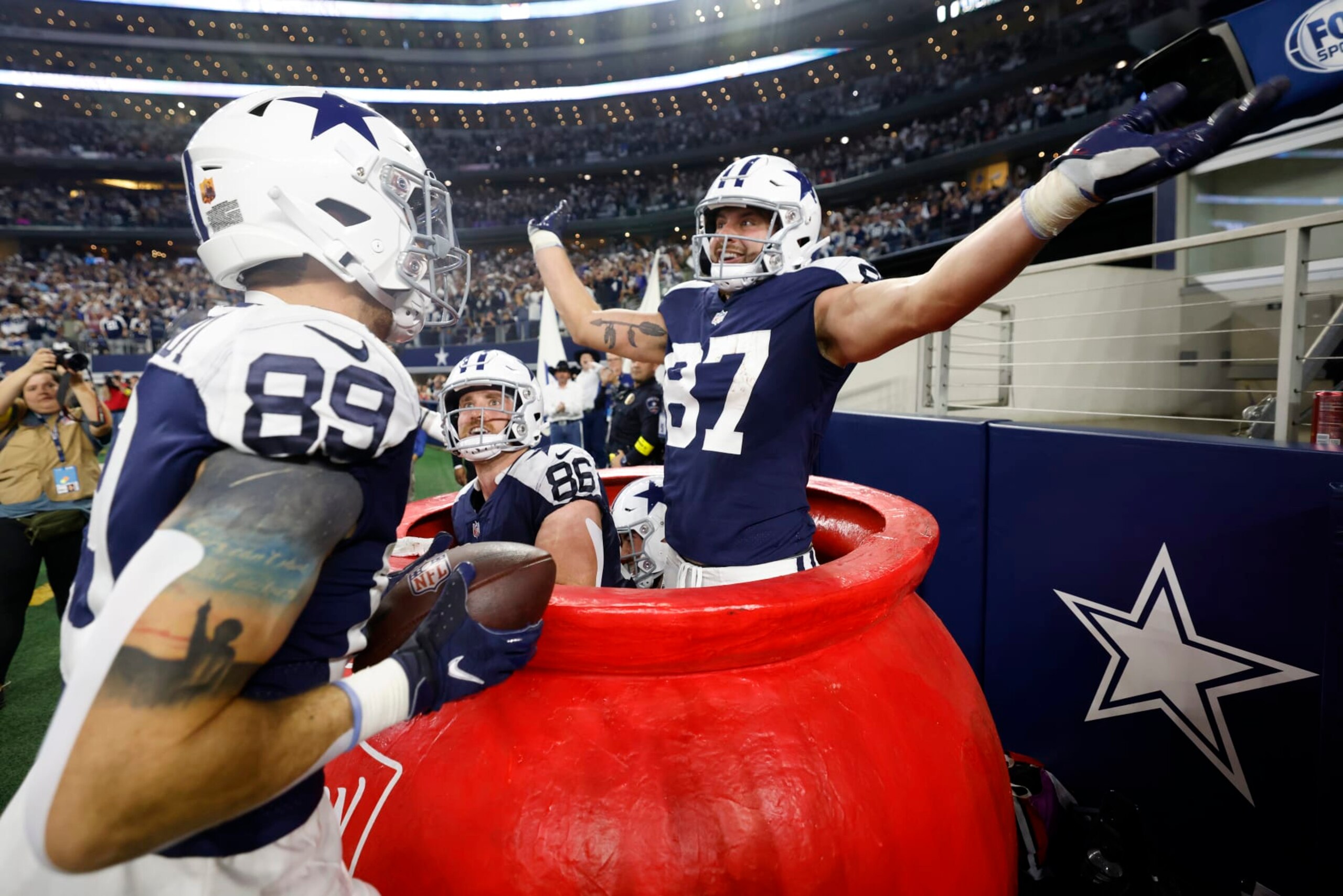 ARLINGTON, TEXAS - NOVEMBER 24: Peyton Hendershot #89 of the Dallas Cowboys celebrates a touchdown with Jake Ferguson #87 and Dalton Schultz #86 during the second half in the game against the New York Giants at AT&T Stadium on November 24, 2022 in Arlington, Texas. (Photo by Wesley Hitt/Getty Images) ARLINGTON, TEXAS - NOVEMBER 24: Peyton Hendershot #89 of the Dallas Cowboys celebrates a touchdown with Jake Ferguson #87 and Dalton Schultz #86 during the second half in the game against the New York Giants at AT&T Stadium on November 24, 2022 in Arlington, Texas. (Photo by Wesley Hitt/Getty Images)
