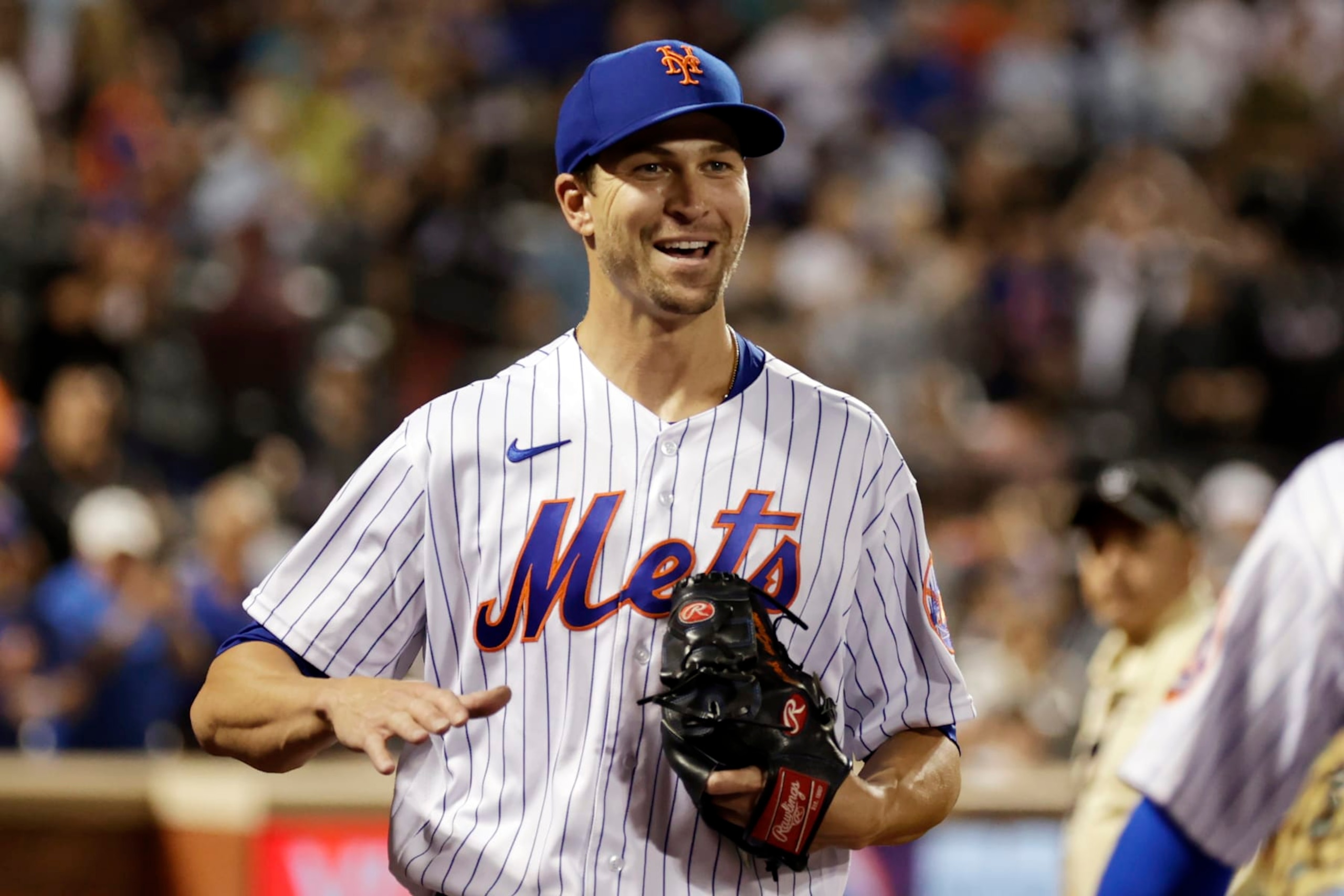 New York Mets pitcher Jacob deGrom reacts toward Brandon Nimmo after the seventh inning of the team's baseball game against the Los Angeles Dodgers on Wednesday, Aug. 31, 2022, in New York. The Mets won 2-1. (AP Photo/Adam Hunger)
