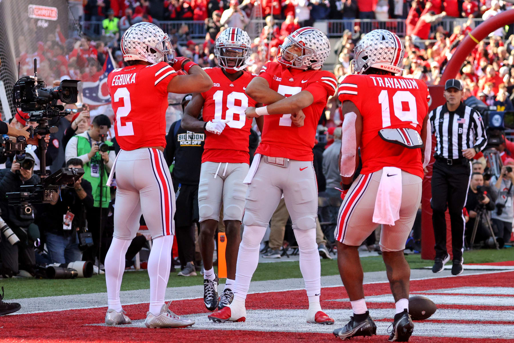 COLUMBUS, OH - NOVEMBER 26: Ohio State Buckeyes wide receiver Emeka Egbuka (2), Ohio State Buckeyes wide receiver Marvin Harrison Jr. (18),  Ohio State Buckeyes quarterback C.J. Stroud (7), and Ohio State Buckeyes quarterback Chad Ray (19) after Egbuka and Stroud combined for a touchdown pass and catch during the first quarter of the college football game between the Michigan Wolverines and Ohio State Buckeyes on November 26, 2022, at Ohio Stadium in Columbus, OH. (Photo by Frank Jansky/Icon Sportswire via Getty Images)