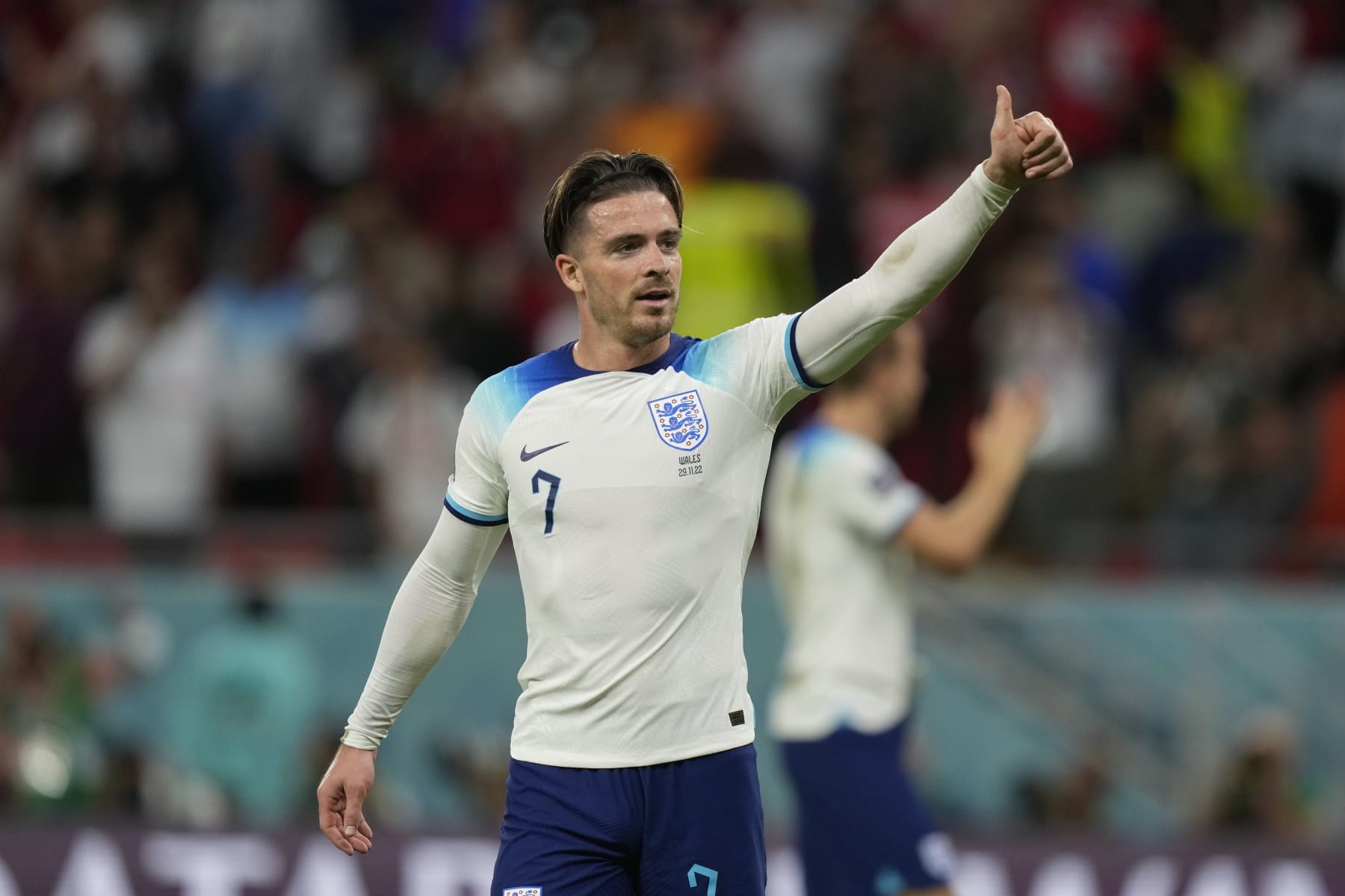 England's Jack Grealish gestures to supporters at the end of the World Cup group B soccer match between England and Wales, at the Ahmad Bin Ali Stadium in Al Rayyan , Qatar, Tuesday, Nov. 29, 2022. England won 3-0. (AP Photo/Frank Augstein)
