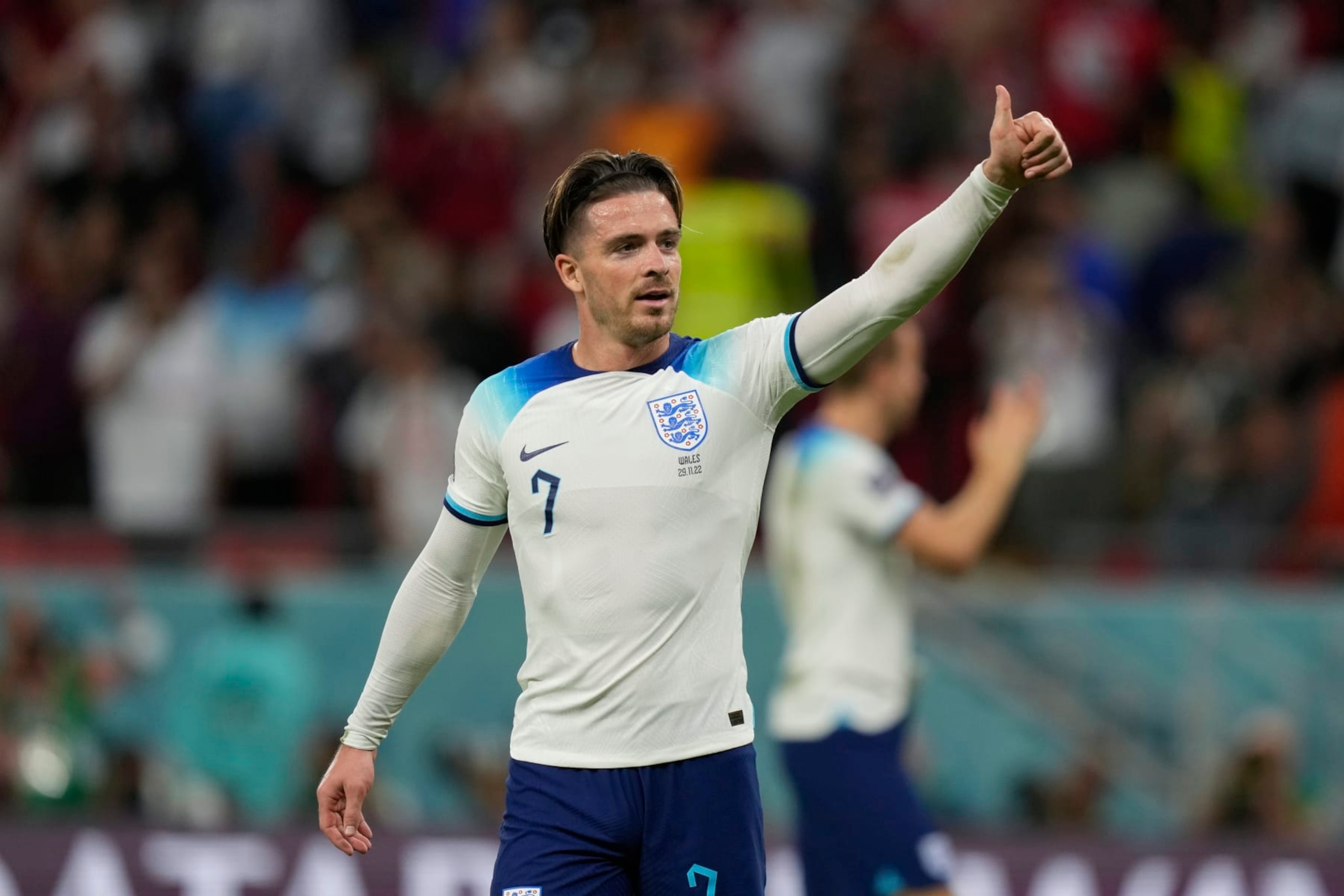 England's Jack Grealish gestures to supporters at the end of the World Cup group B soccer match between England and Wales, at the Ahmad Bin Ali Stadium in Al Rayyan , Qatar, Tuesday, Nov. 29, 2022. England won 3-0. (AP Photo/Frank Augstein)