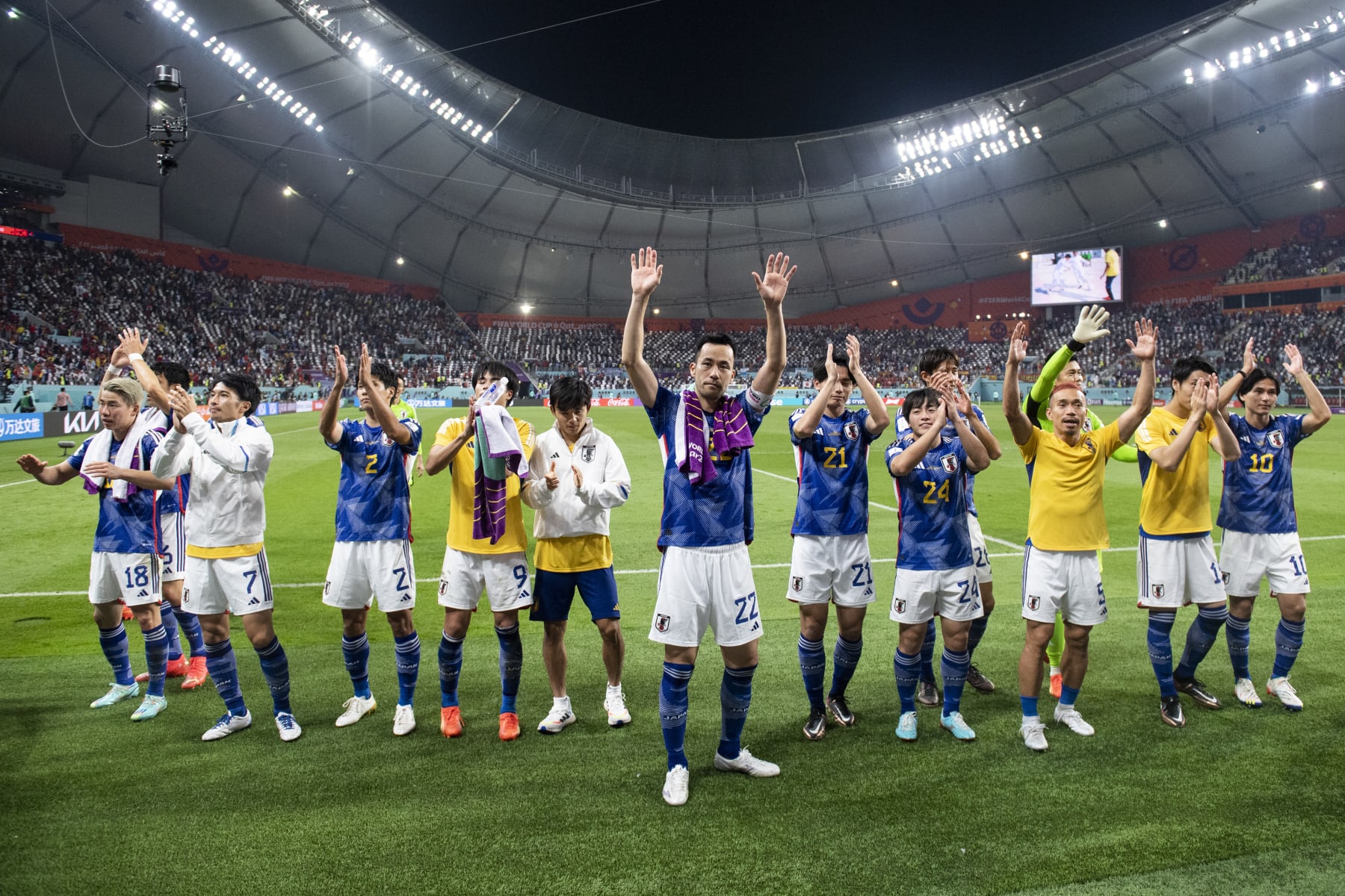 DOHA, QATAR - DECEMBER 01: Japan players celebrate winning the group as they applaud their fans at the end of the FIFA World Cup Qatar 2022 Group E match between Japan and Spain at Khalifa International Stadium on December 1, 2022 in Doha, Qatar. (Photo by Sebastian Frej/MB Media)