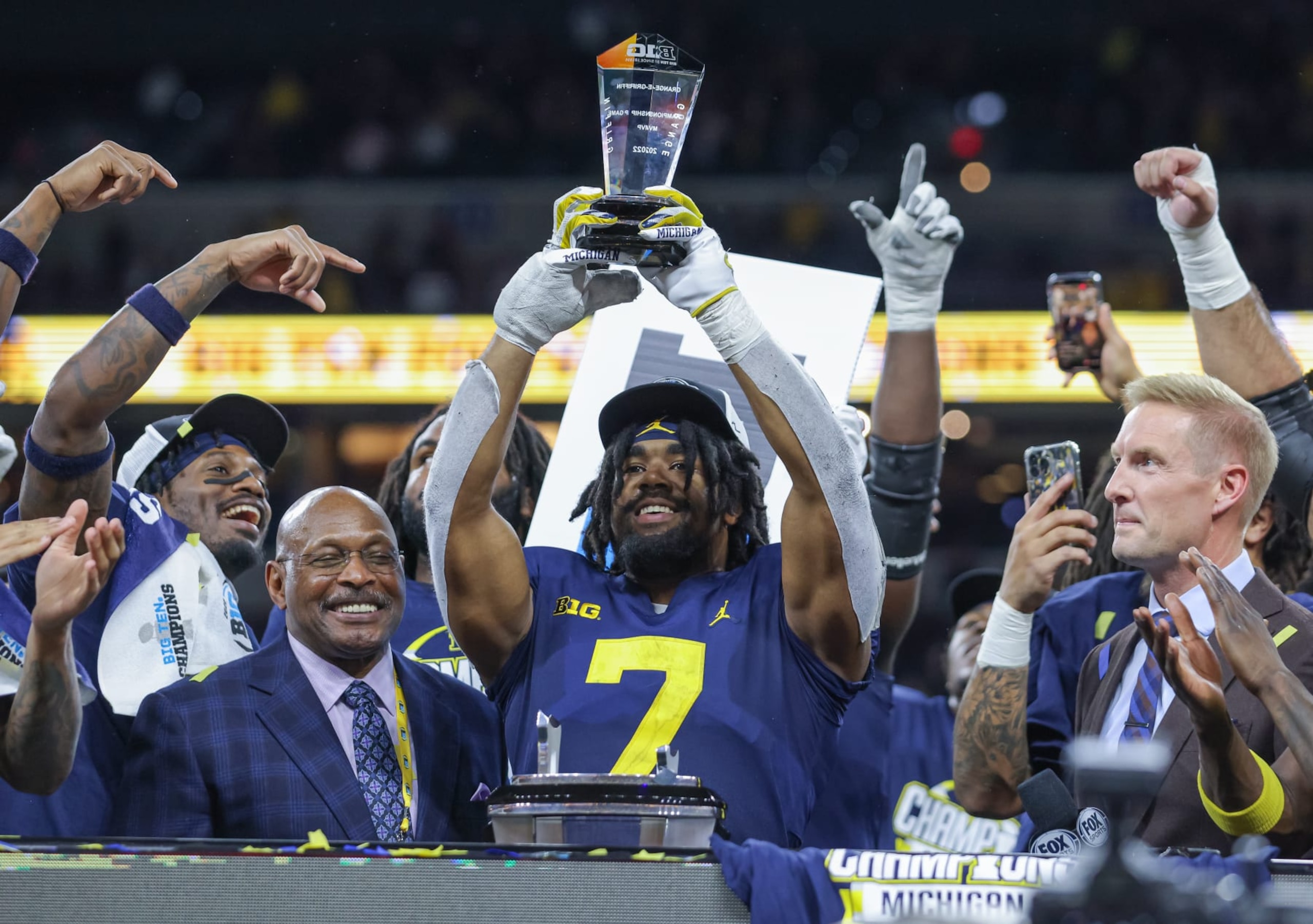 INDIANAPOLIS, IN - DECEMBER 04: Donovan Edwards #7 of the Michigan Wolverines holds the MVP trophy following the game against the Purdue Boilermakers in the Big Ten Championship at Lucas Oil Stadium on December 4, 2022 in Indianapolis, Indiana. (Photo by Michael Hickey/Getty Images)