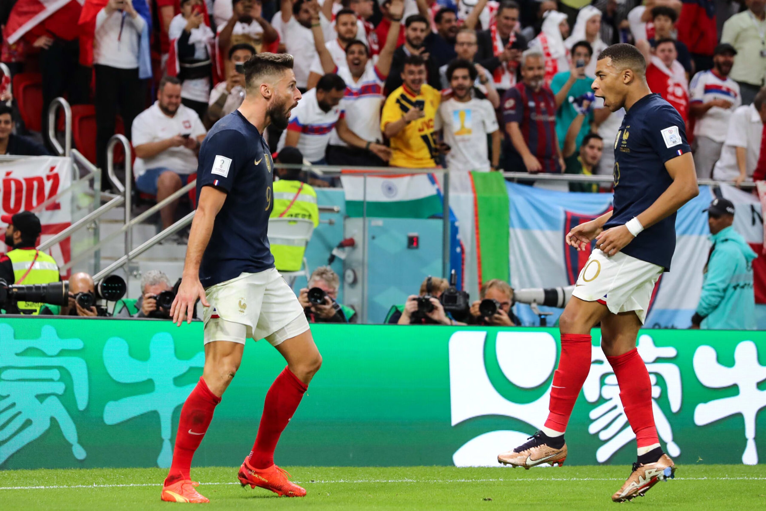 DOHA, QATAR - DECEMBER 04: Olivier Giroud of France celebrates with team mate Kylian Mbappe on becoming the all-time leading goalscorer for the France National team after scoring to give the side a 1-0 lead during the FIFA World Cup Qatar 2022 Round of 16 match between France and Poland at Al Thumama Stadium on December 04, 2022 in Doha, Qatar. (Photo by Youssef Loulidi/Fantasista/Getty Images) DOHA, QATAR - DECEMBER 04: Olivier Giroud of France celebrates with team mate Kylian Mbappe on becoming the all-time leading goalscorer for the France National team after scoring to give the side a 1-0 lead during the FIFA World Cup Qatar 2022 Round of 16 match between France and Poland at Al Thumama Stadium on December 04, 2022 in Doha, Qatar. (Photo by Youssef Loulidi/Fantasista/Getty Images)