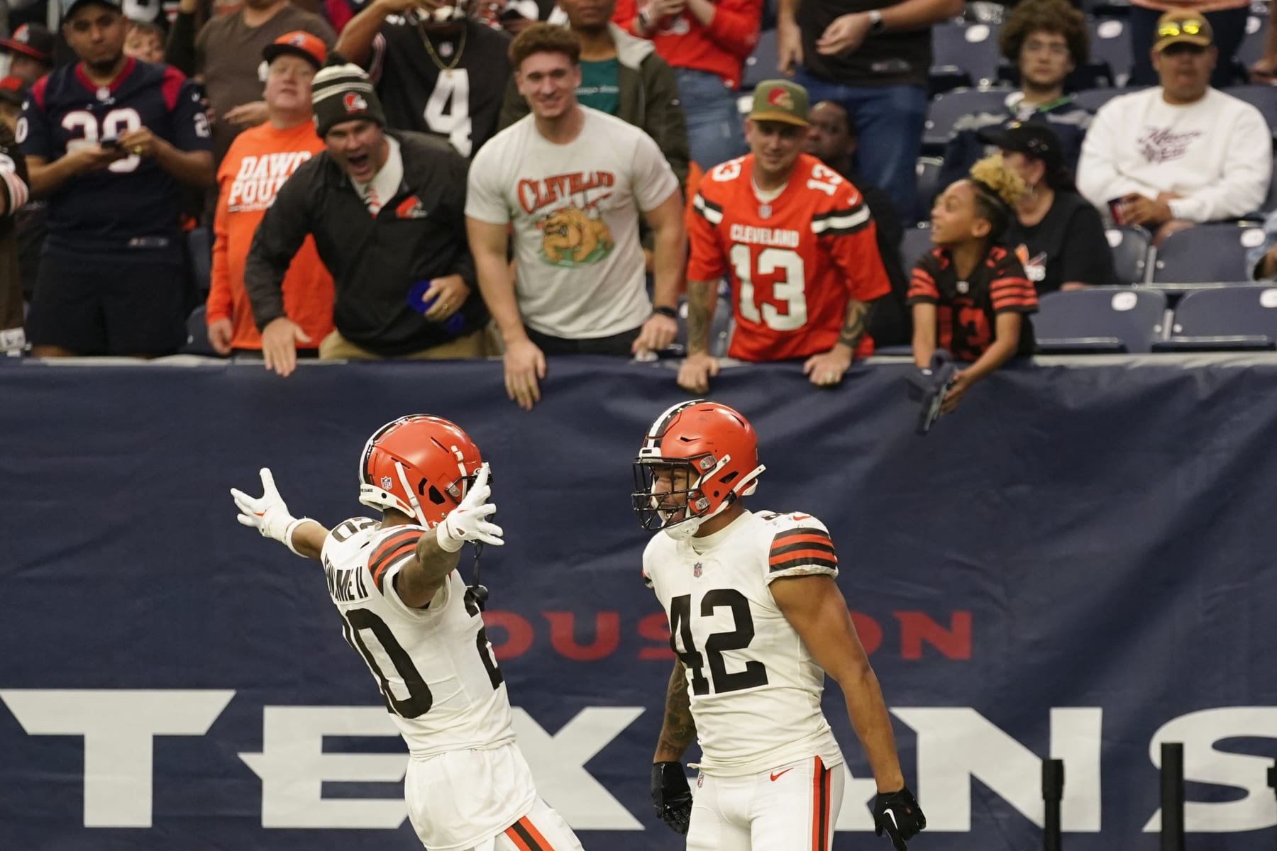 Cleveland Browns linebacker Tony Fields II (42) celebrates with Greg Newsome II after scoring on an interception from Houston Texans quarterback Kyle Allen during the second half of an NFL football game between the Cleveland Browns and Houston Texans in Houston, Sunday, Dec. 4, 2022. (AP Photo/Eric Christian Smith)