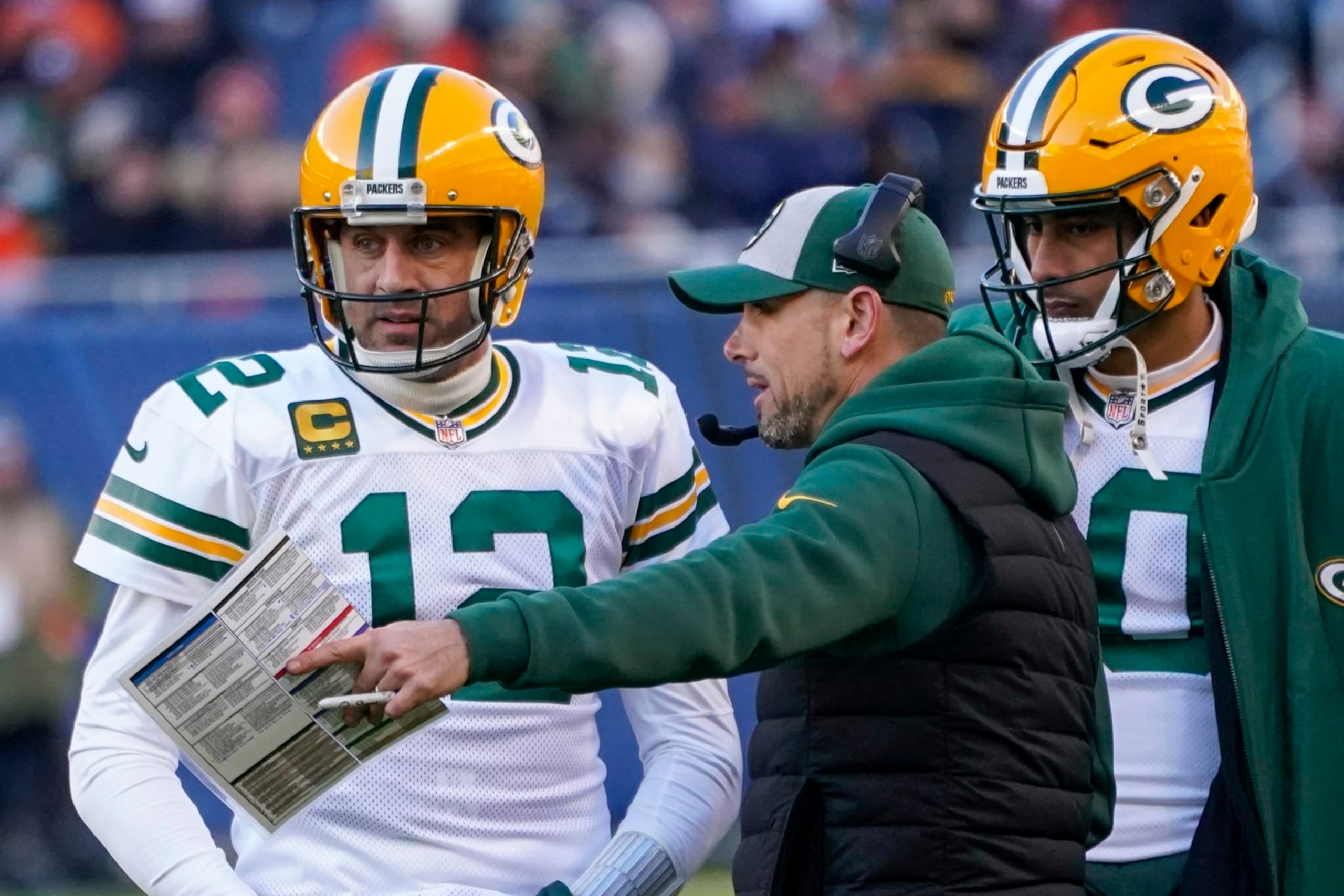 Green Bay Packers head coach Matt LaFleur talks to Aaron Rodgers during the second half of an NFL football game against the Chicago Bears Sunday, Dec. 4, 2022, in Chicago. (AP Photo/Charles Rex Arbogast) Green Bay Packers head coach Matt LaFleur talks to Aaron Rodgers during the second half of an NFL football game against the Chicago Bears Sunday, Dec. 4, 2022, in Chicago. (AP Photo/Charles Rex Arbogast)