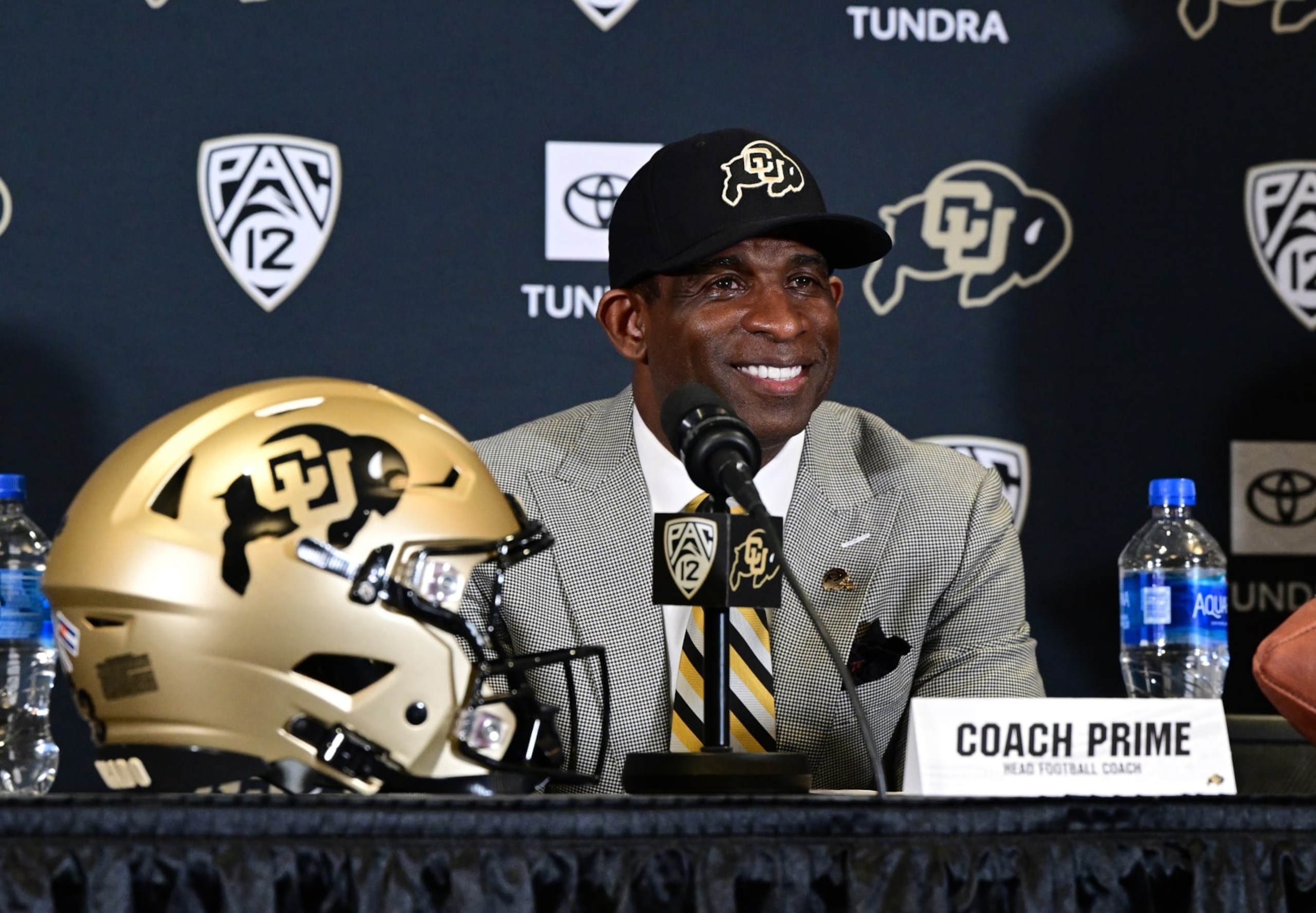 BOULDER, CO - DECEMBER 4:  Deion Sanders, CUs new head football coach, takes questions in the Arrow Touchdown Club during a press conference on December 4, 2022 in Boulder, Colorado. CU held an introductory press conference to announce the hiring of Deion Coach Prime Sanders as the schools new head football coach. Chancellor Phil DiStefano and athletic director Rick George accompanied Sanders into a packed room in the Arrow Touchdown Club inside the Dal Ward Athletic Center. Sanders becomes the 28th head coach in Buffalo football history.  Sanders, who known as Prime Time during his Hall of Fame playing career has since transitioned into Coach Prime as a head football coach. Sanders, 55, joins the CU program from Jackson State University where in three seasons the Tigers compiled a 27-5 record and won back-to-back Southwestern Athletic Conference championships. (Photo by Helen H. Richardson/MediaNews Group/The Denver Post via Getty Images)