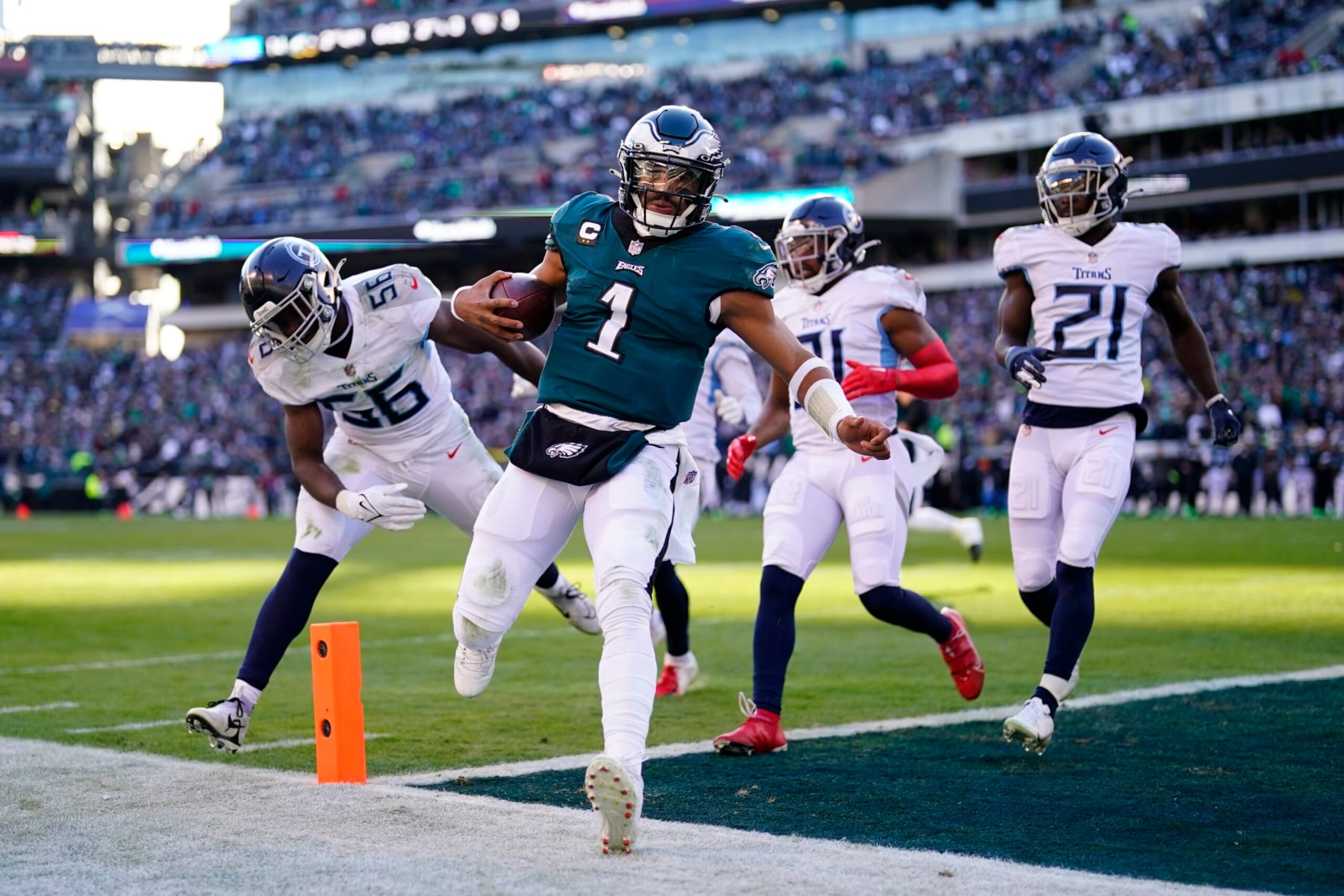 Philadelphia Eagles' Jalen Hurts runs the ball in for a touchdown during the first half of an NFL football game against the Tennessee Titans, Sunday, Dec. 4, 2022, in Philadelphia. (AP Photo/Matt Rourke)