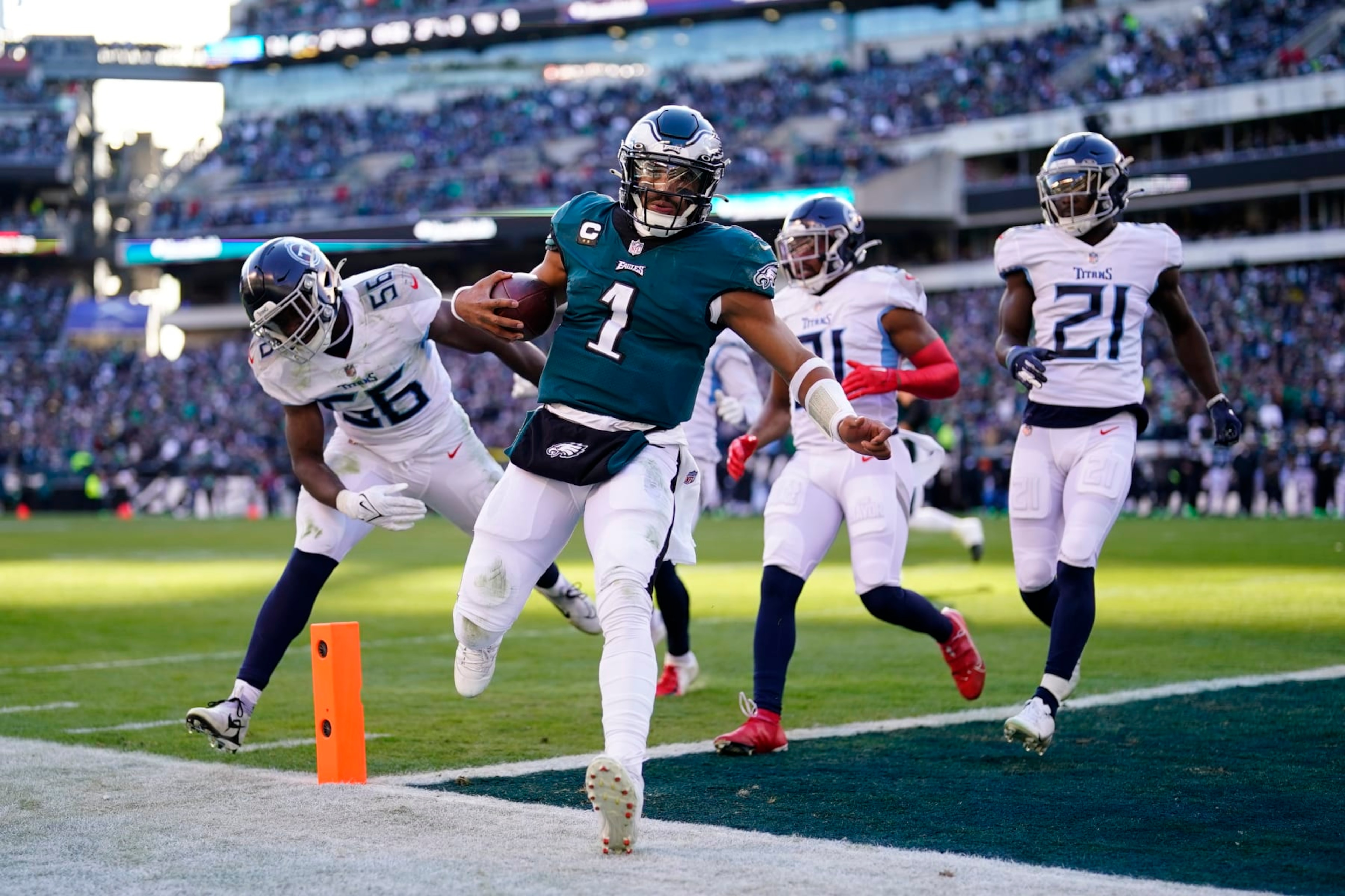 Philadelphia Eagles' Jalen Hurts runs the ball in for a touchdown during the first half of an NFL football game against the Tennessee Titans, Sunday, Dec. 4, 2022, in Philadelphia. (AP Photo/Matt Rourke)