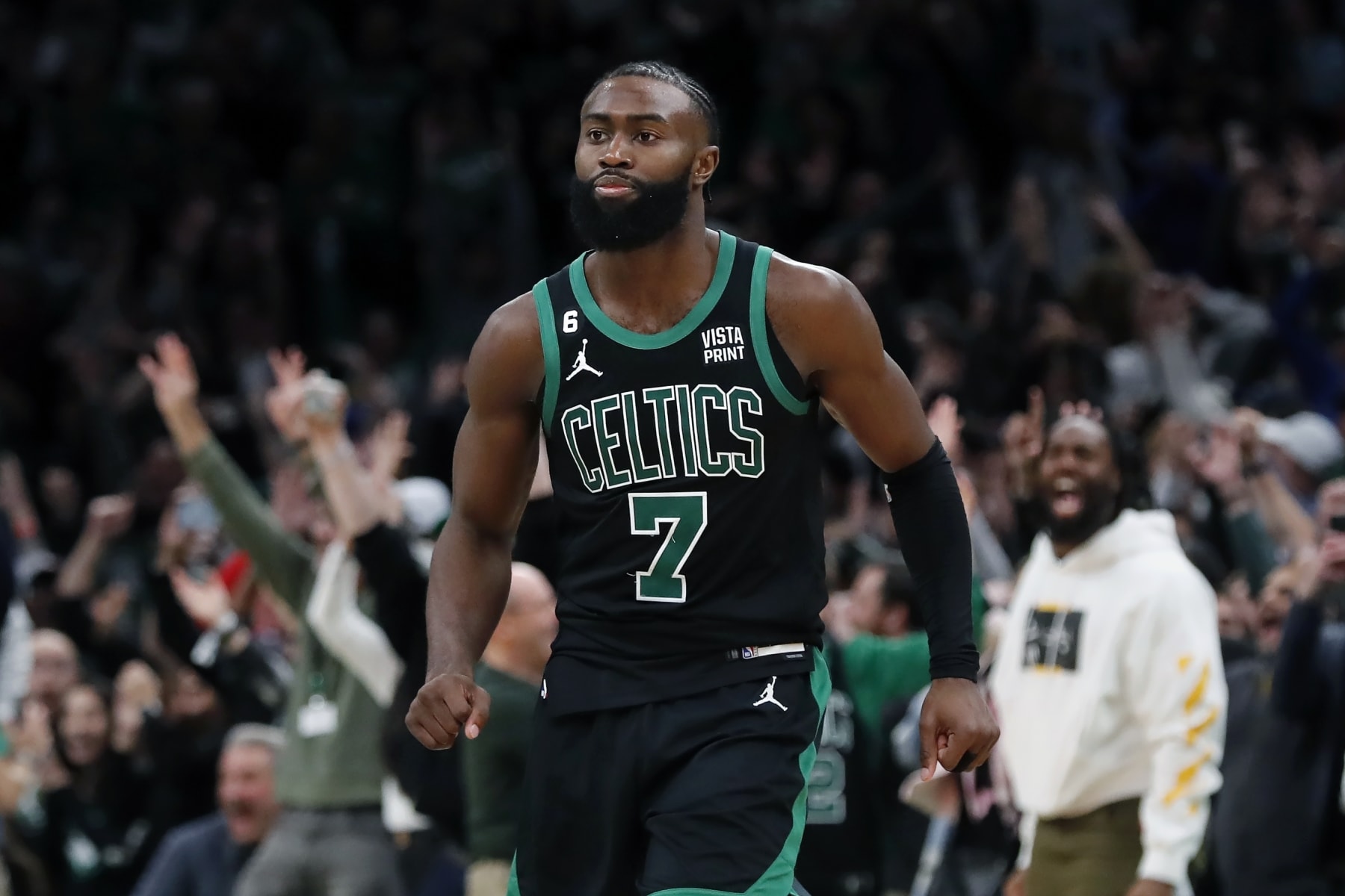 Boston Celtics' Jaylen Brown reacts after making the tying three-pointer during the second half of an NBA basketball game against the Miami Heat, Friday, Dec. 2, 2022, in Boston. (AP Photo/Michael Dwyer)