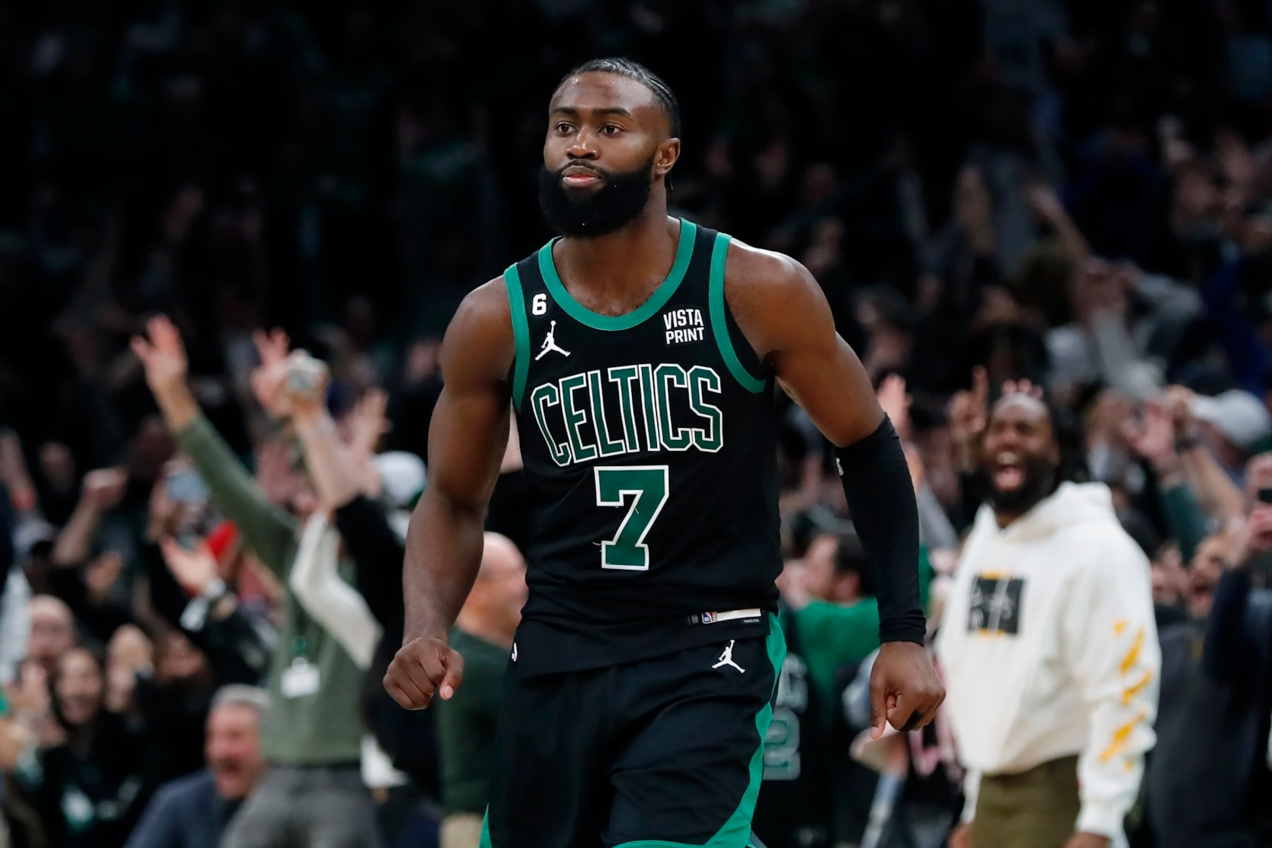 Boston Celtics' Jaylen Brown reacts after making the tying three-pointer during the second half of an NBA basketball game against the Miami Heat, Friday, Dec. 2, 2022, in Boston. (AP Photo/Michael Dwyer)