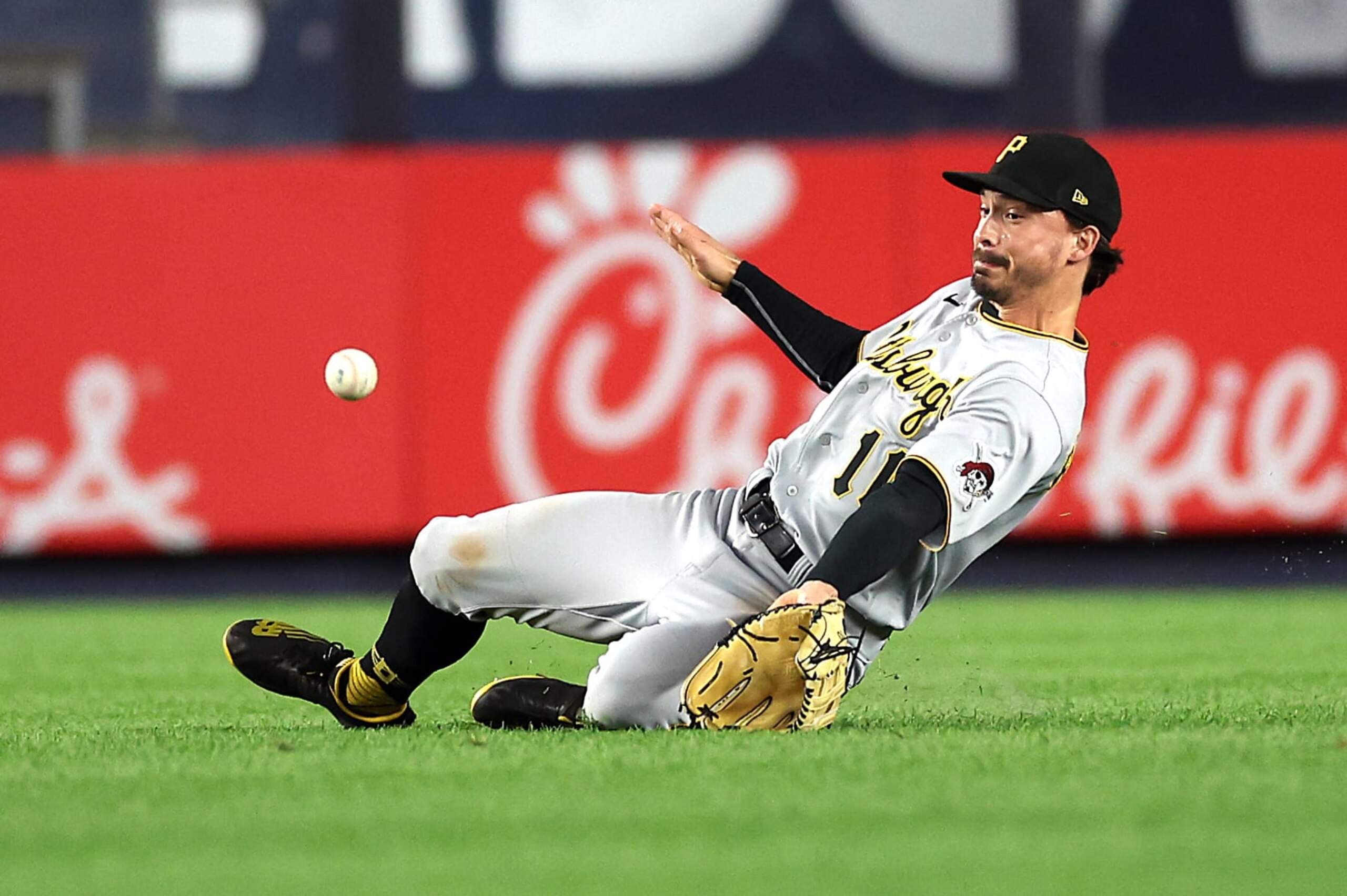 NEW YORK, NEW YORK - SEPTEMBER 20:  Bryan Reynolds #10 of the Pittsburgh Pirates slides but misses the ball off the bat of Jose Trevino #39 of the New York Yankees that scores Harrison Bader #22 during the 5th inning of the game at Yankee Stadium on September 20, 2022 in the Bronx borough of New York City. (Photo by Jamie Squire/Getty Images)