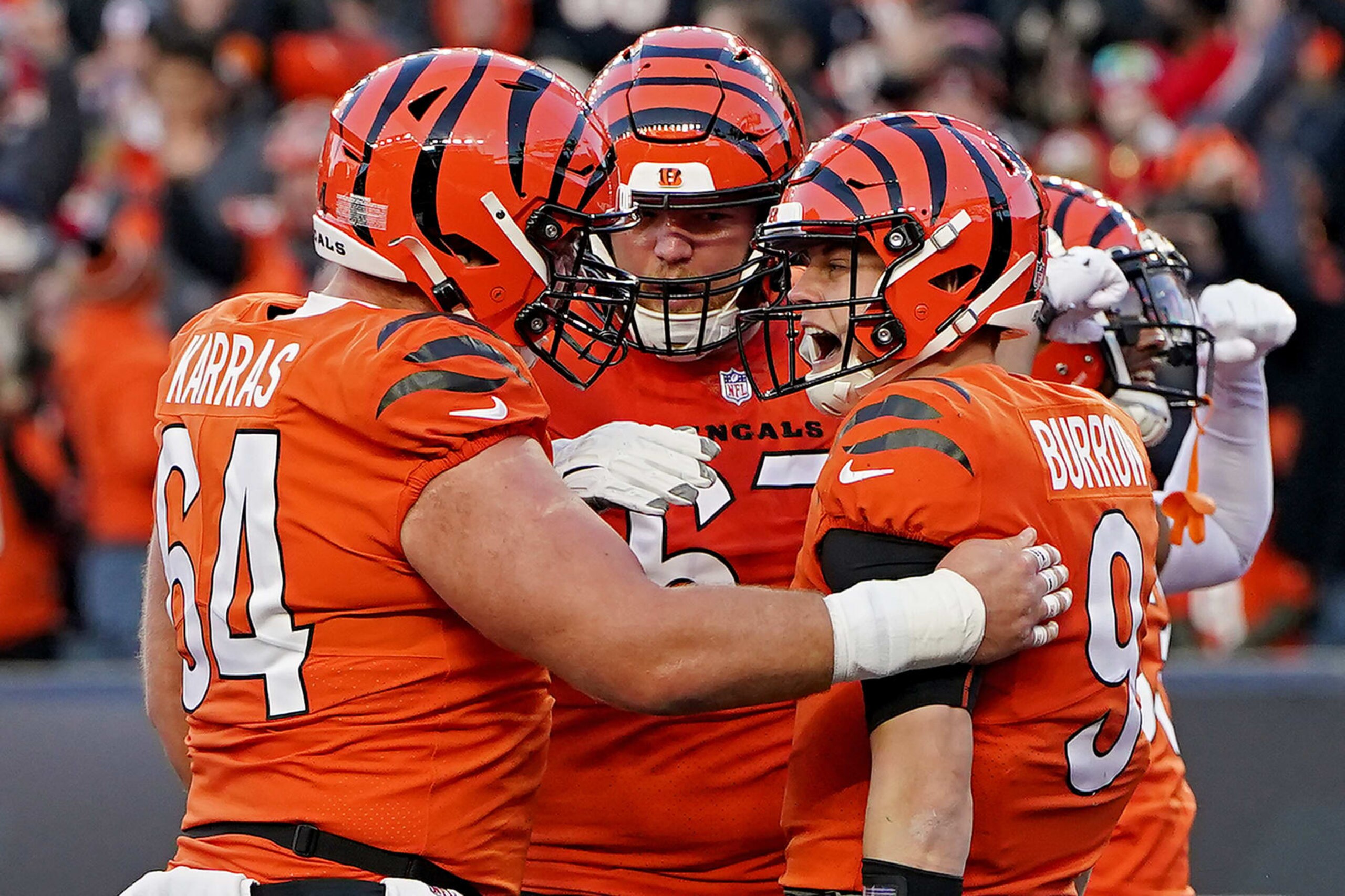 CINCINNATI, OHIO - DECEMBER 04: Joe Burrow #9 of the Cincinnati Bengals celebrates with teammates after rushing for a touchdown against the Kansas City Chiefs during the first quarter at Paycor Stadium on December 04, 2022 in Cincinnati, Ohio. (Photo by Dylan Buell/Getty Images)