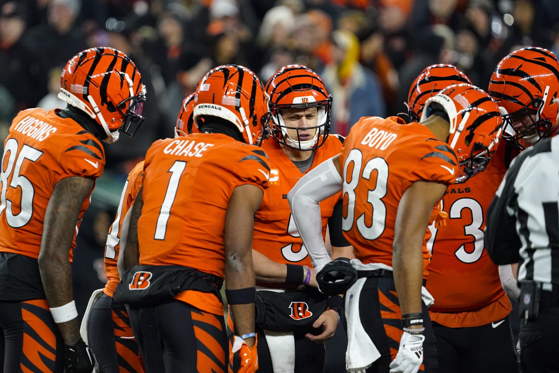 Cincinnati Bengals quarterback Joe Burrow (9) huddle with his team as they played against the Kansas City Chiefs in the first half of an NFL football game in Cincinnati, Sunday, Dec. 4, 2022. (AP Photo/Joshua Bickel)