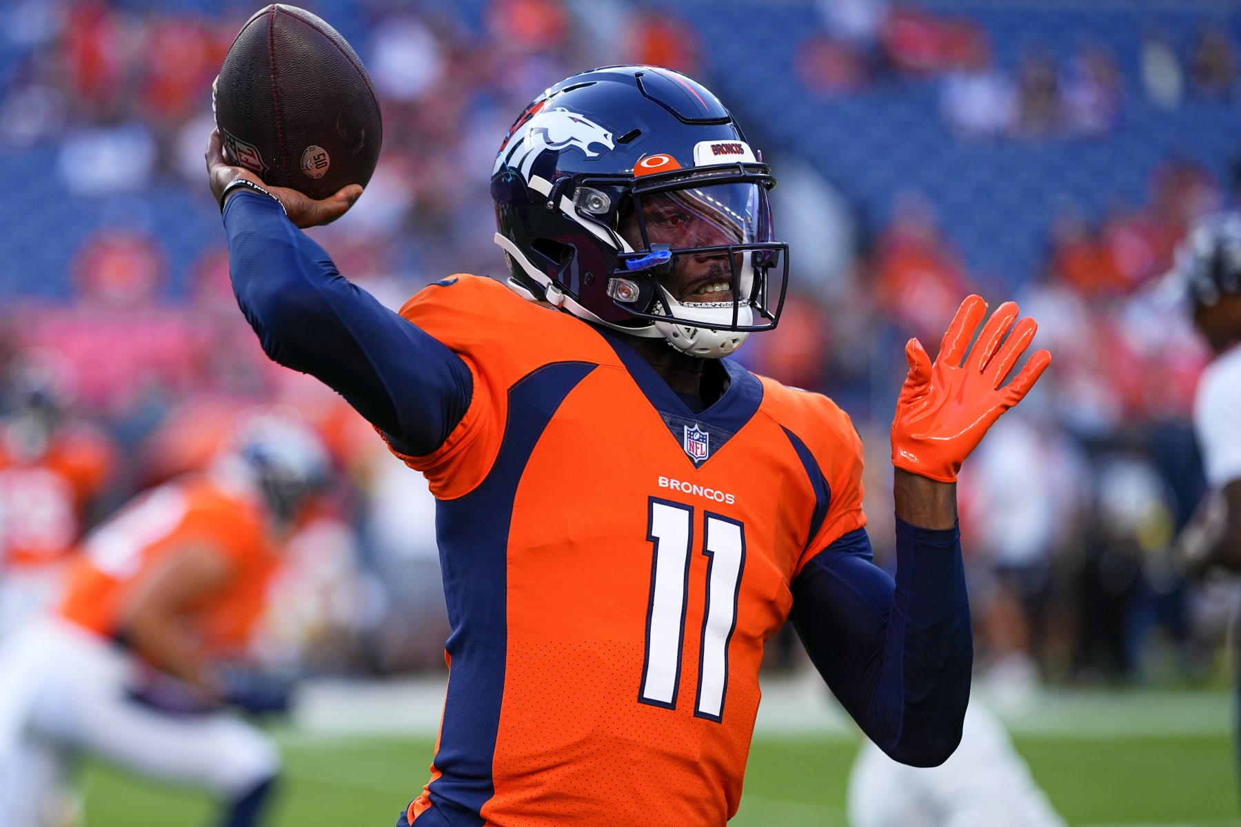 Denver Broncos quarterback Josh Johnson (11) warms up against the Minnesota Vikings during an NFL preseason football game, Saturday, Aug. 27, 2022, in Denver. (AP Photo/Jack Dempsey)